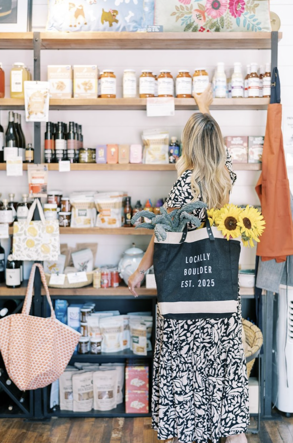 Kim Genung, Editor-in-Chief of Locally Boulder in a store in Boulder, Colorado.