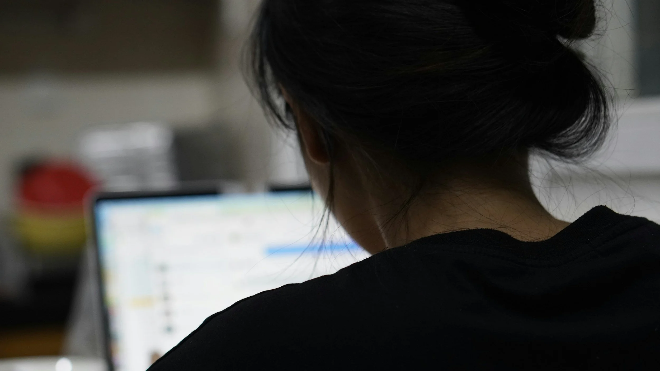 Professional completing a self-paced online course on a laptop.