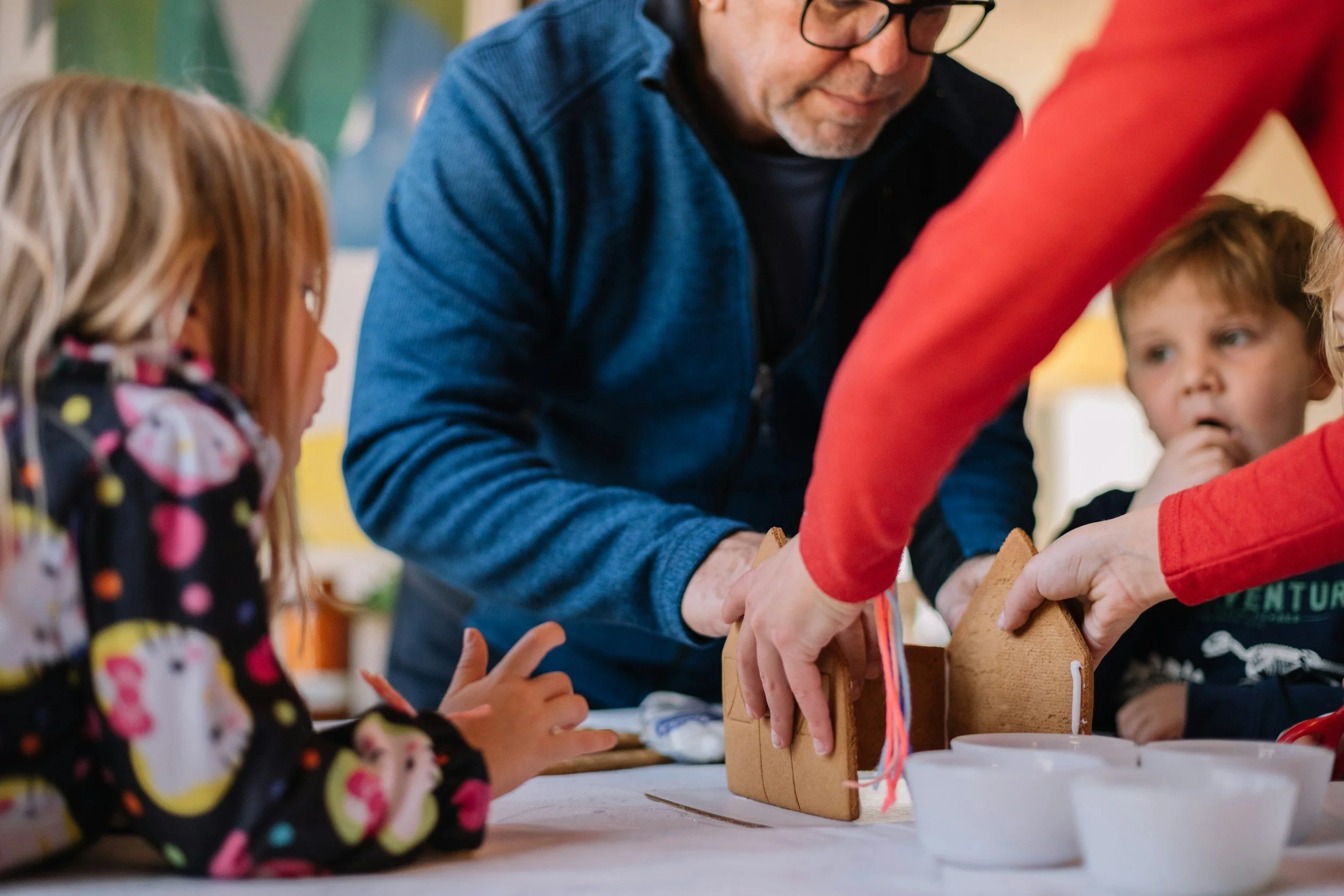 Educators and families participating in a hands-on learning activity that strengthens partnerships and supports lasting program outcomes.
