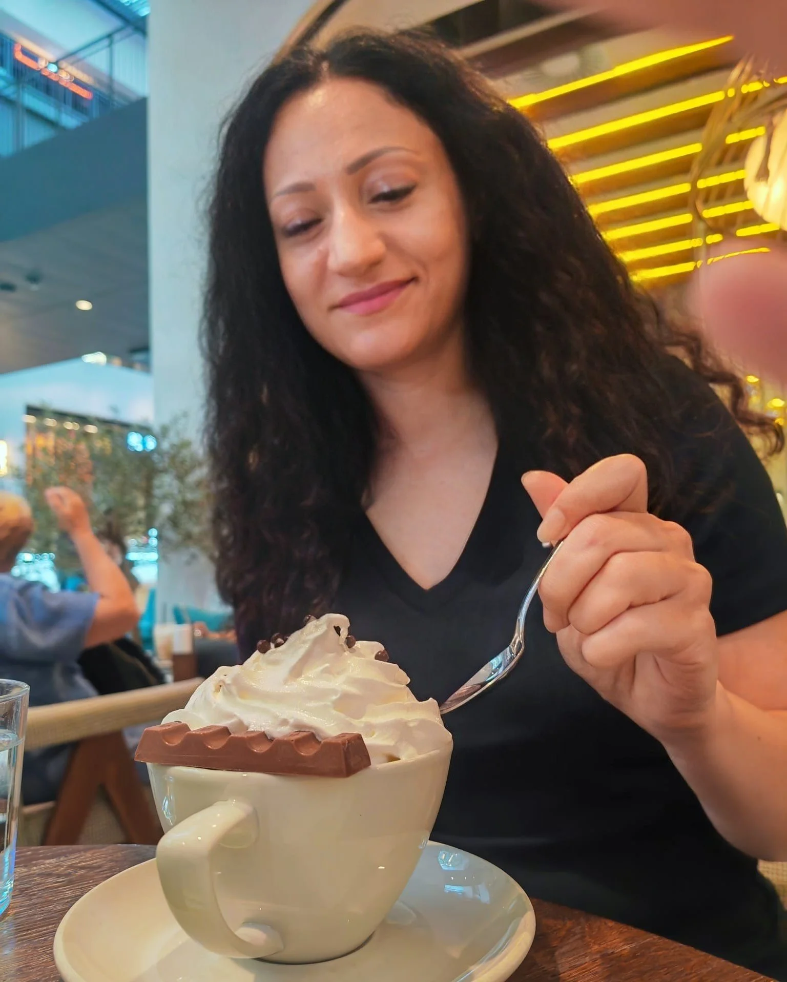 Stasha is drinking hot chocolate.