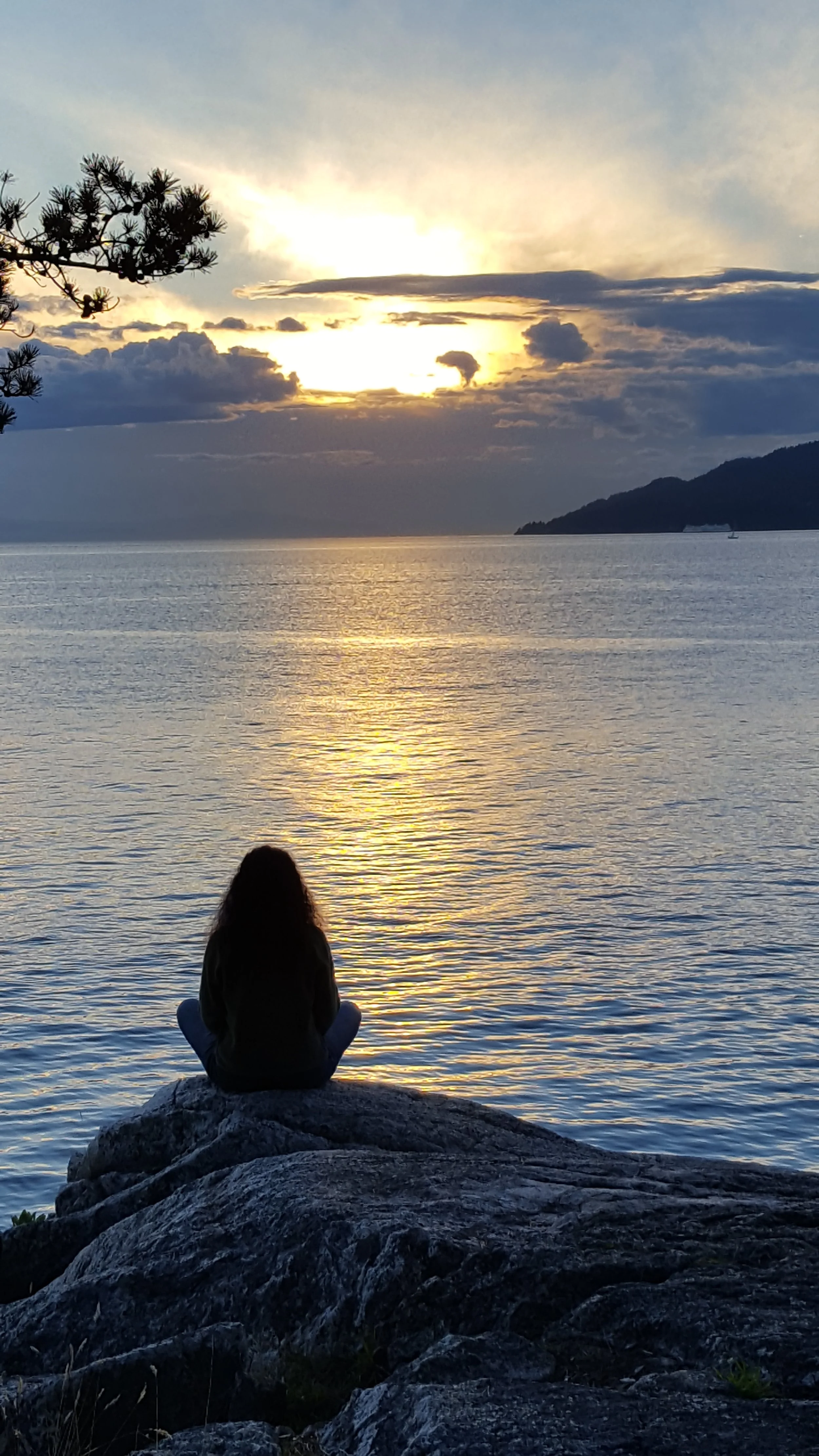 Stasha is looking at the ocean.