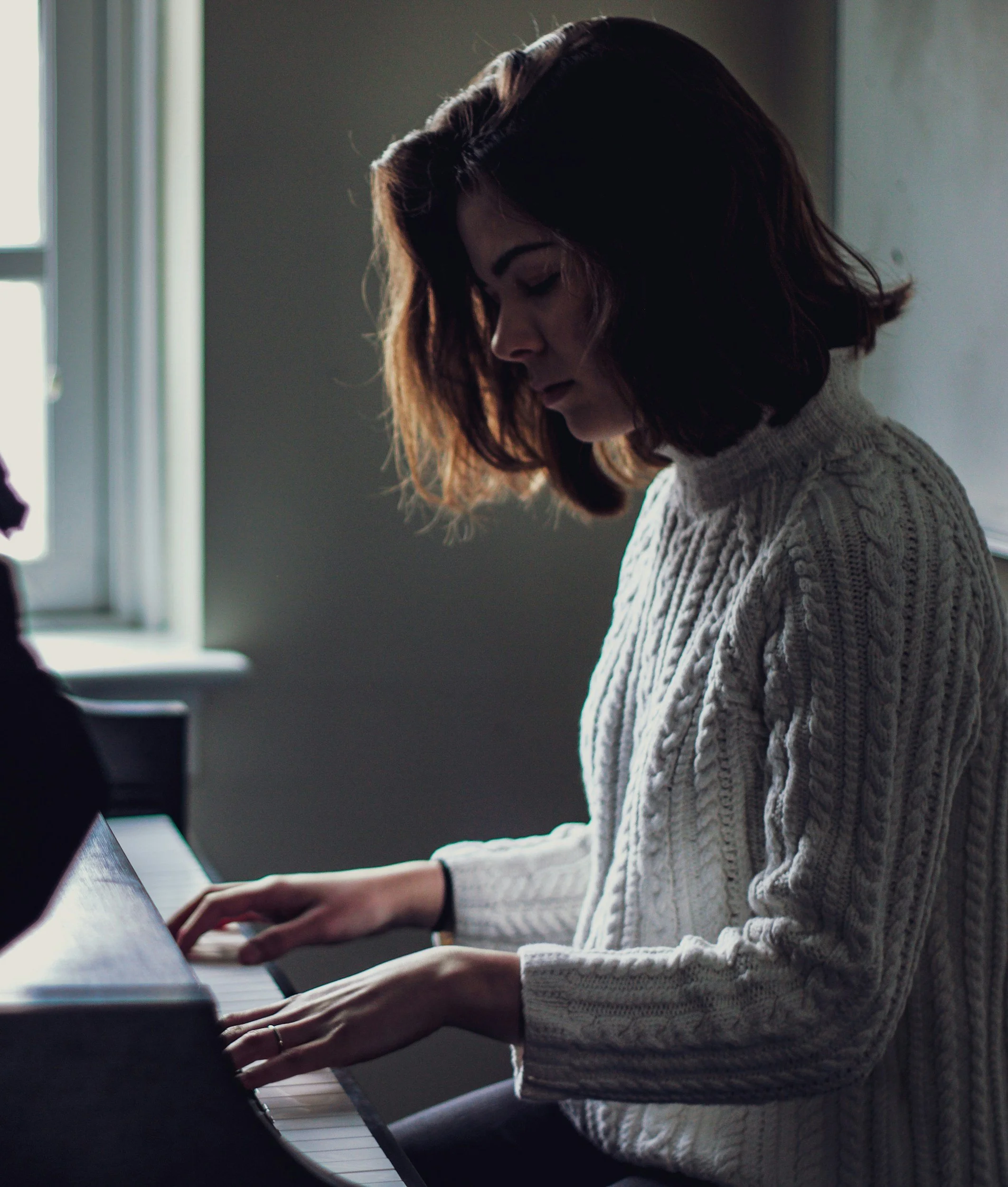 Woman practicing piano