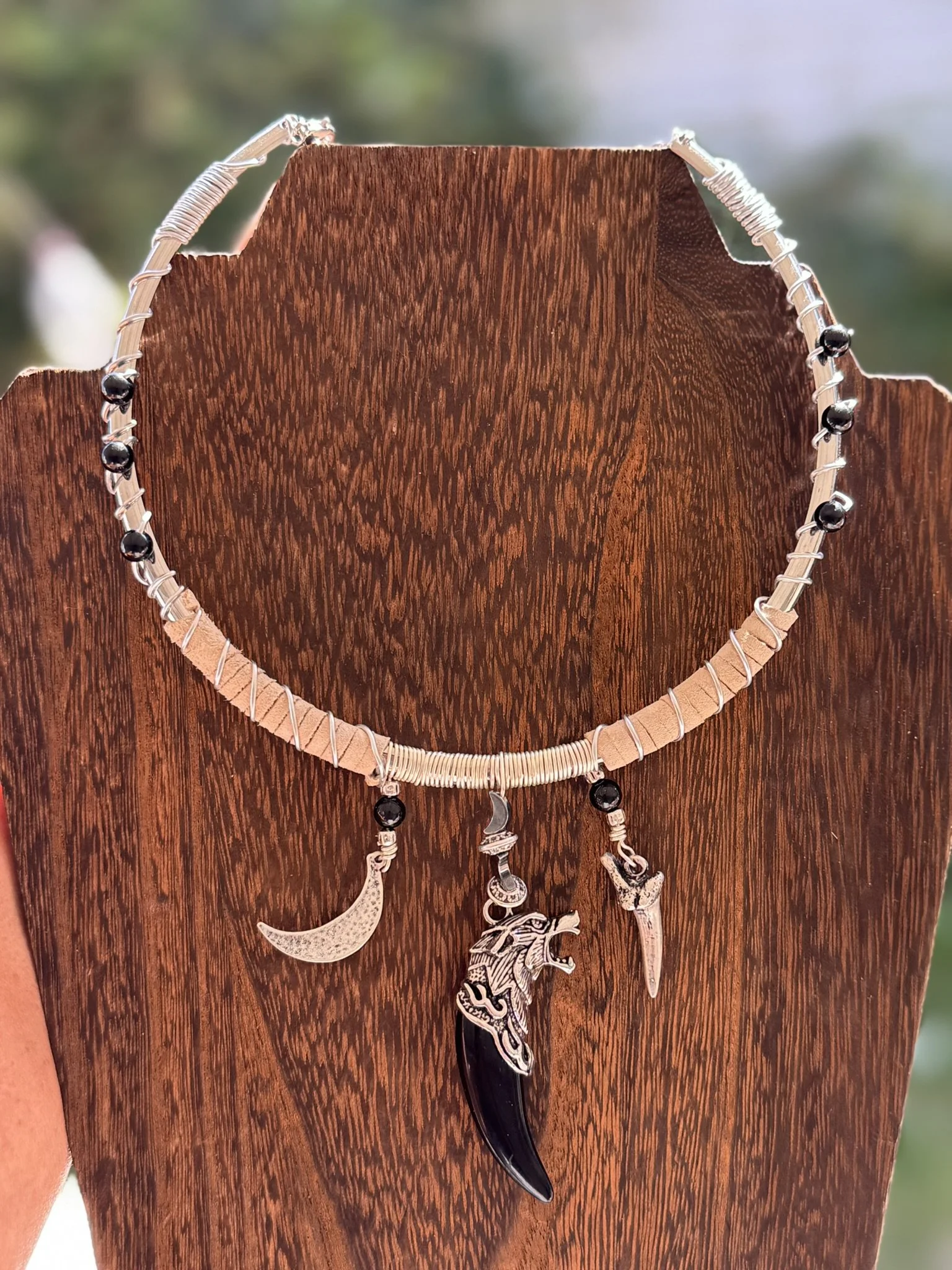 Silver plated torc necklace with charms