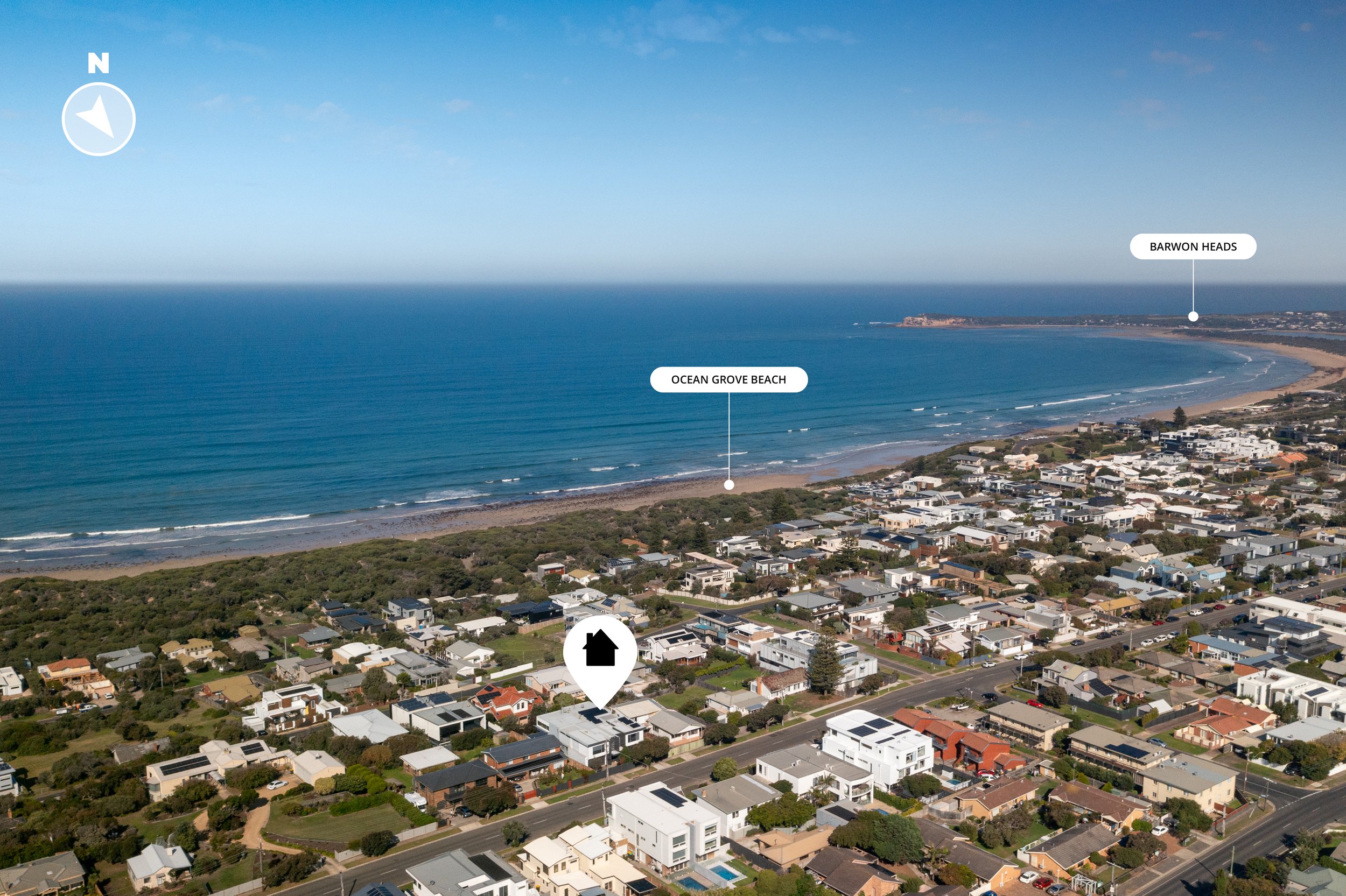 Aerial view of Ocean Grove Beach with residential houses, a beach, and ocean, labeled with landmarks 'Ocean Grove Beach' and 'Barwon Heads' in the distance.