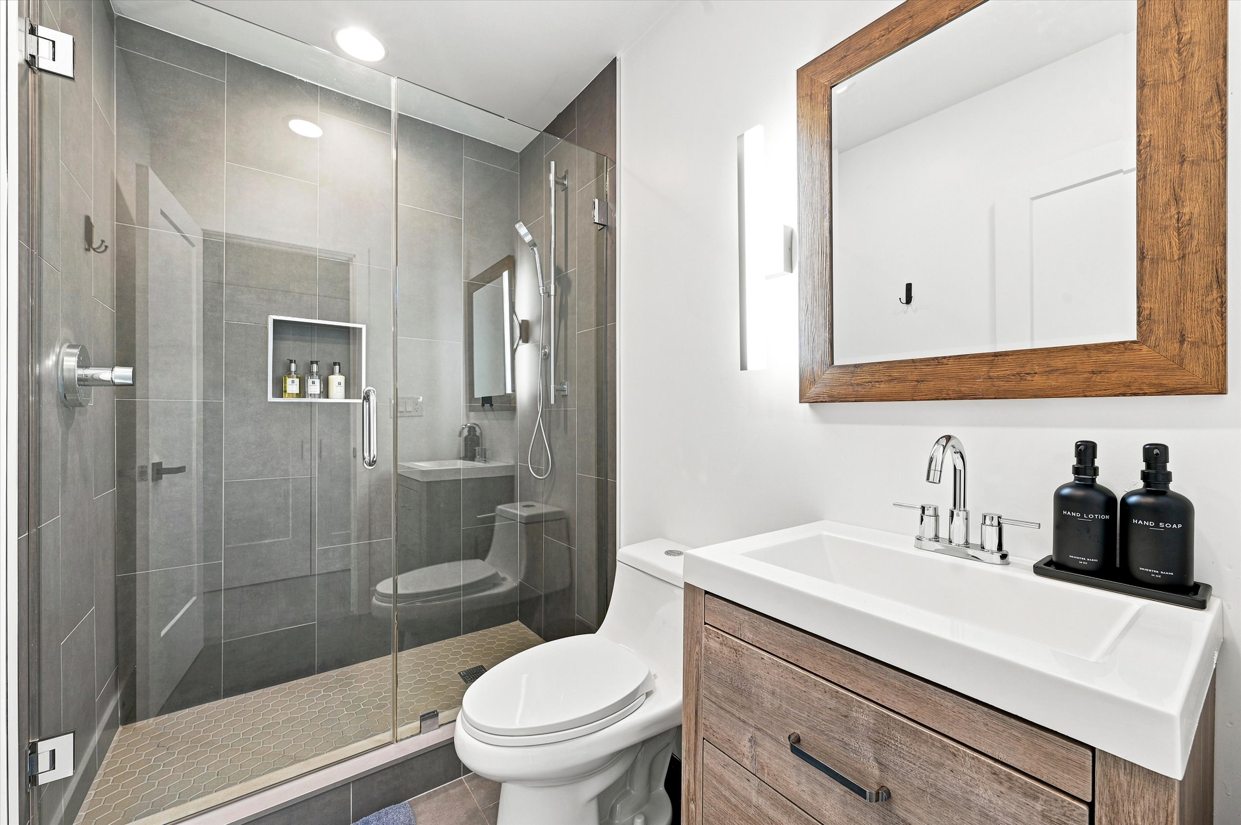 In-suite Bathroom with shower and storage.jpg