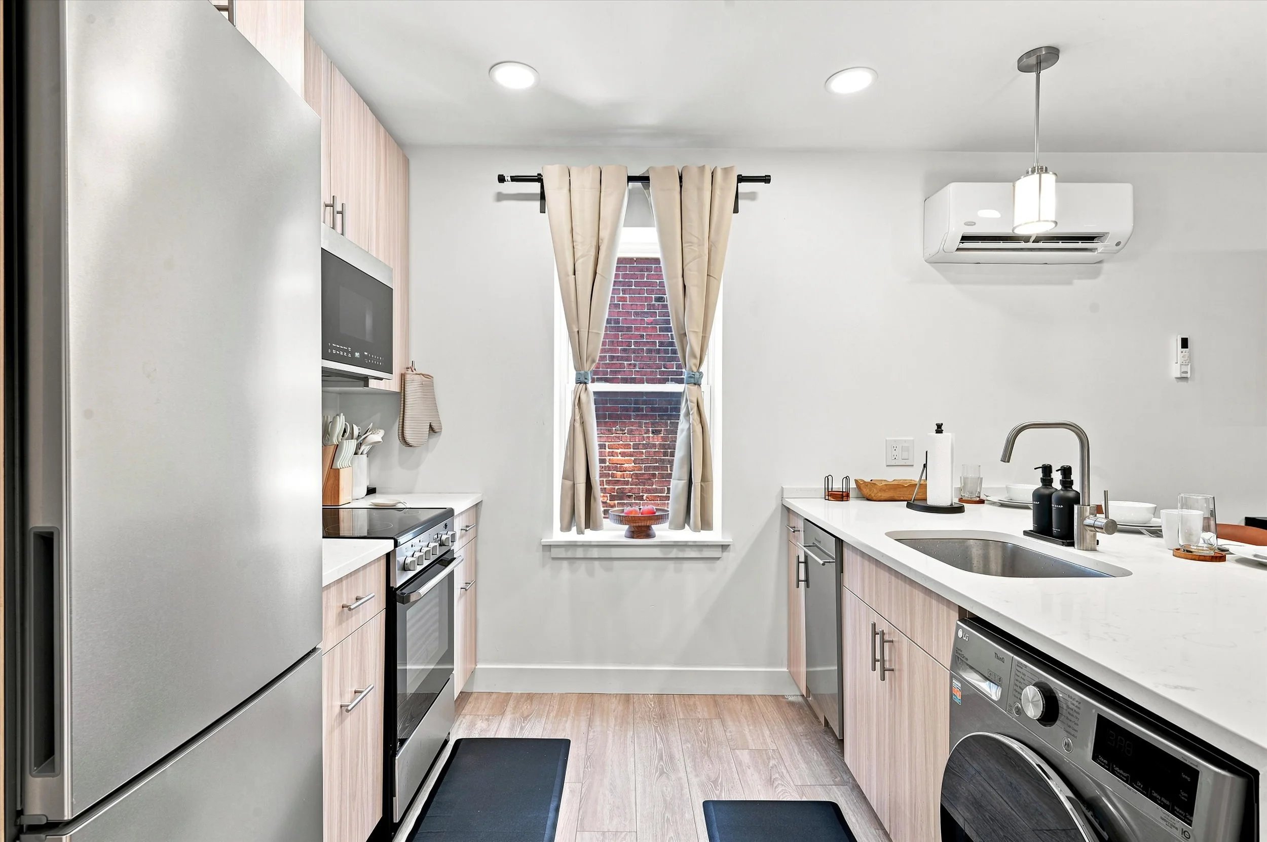 Beautiful Fully Stocked Kitchen with Dishwasher Stove Oven Stainless Steel Appliance Fridge and Freezer Smart LG Washer Dryer - Mini Split.jpg