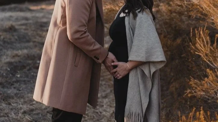 Dr. Naroth with her husband during her 3rd pregnancy.