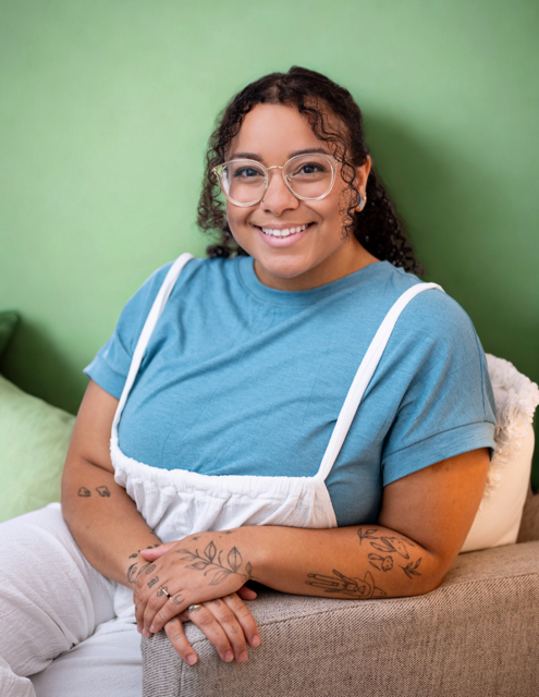 Sydney Dawson, Licensed Professional Counselor and founder of Viridian Counseling, smiling with arms crossed in a professional headshot