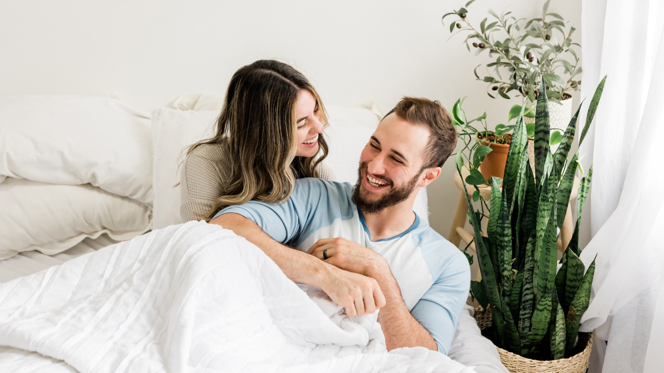 A couple smiling and connecting together, representing couples counseling in Connecticut at Viridian Counseling