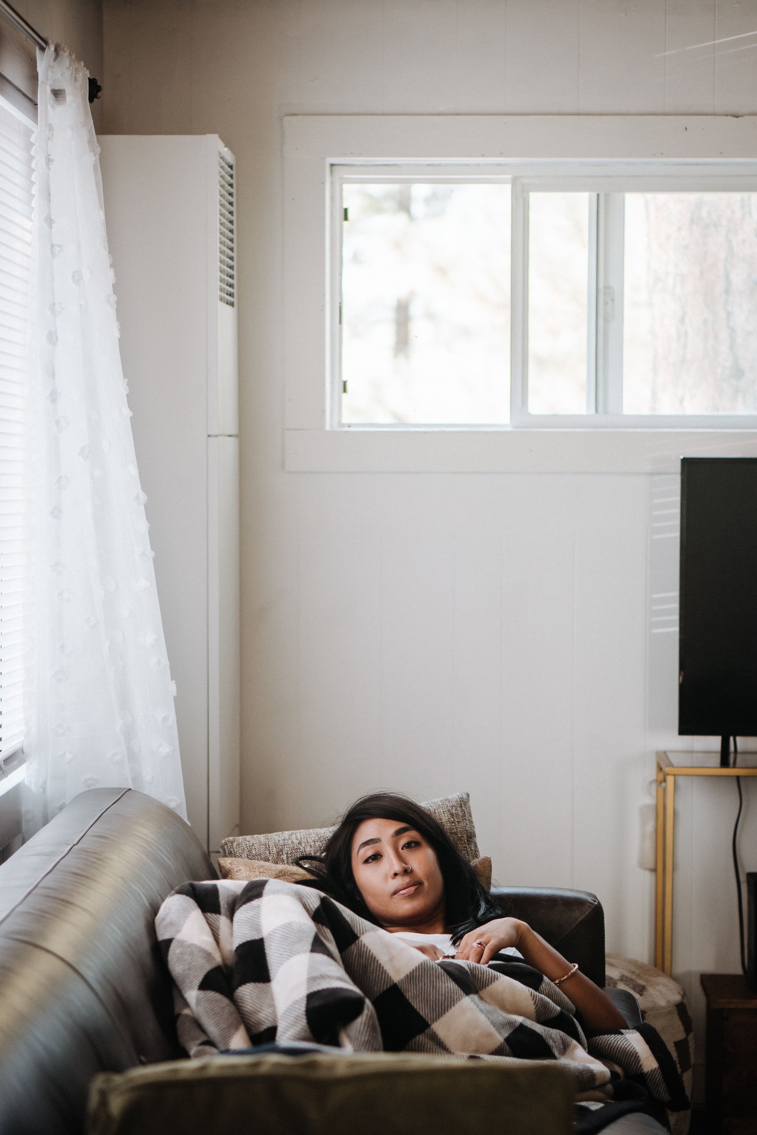 A tired professional in a busy workplace environment, representing the workplace burnout epidemic affecting adults in 2026