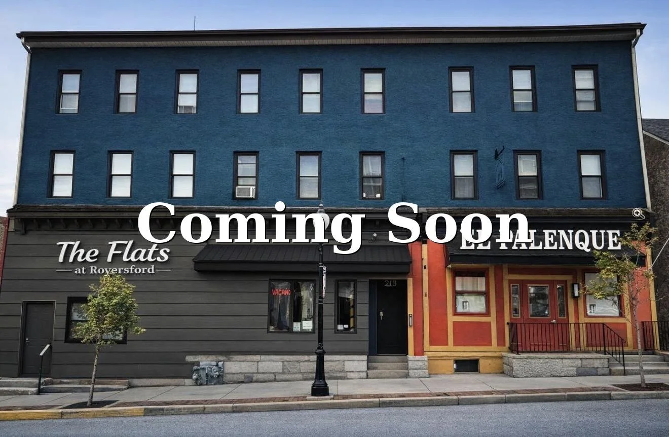 Colorful building with a sign that says "The Flats at Ryersford," and an overlay that says "Coming Soon."
