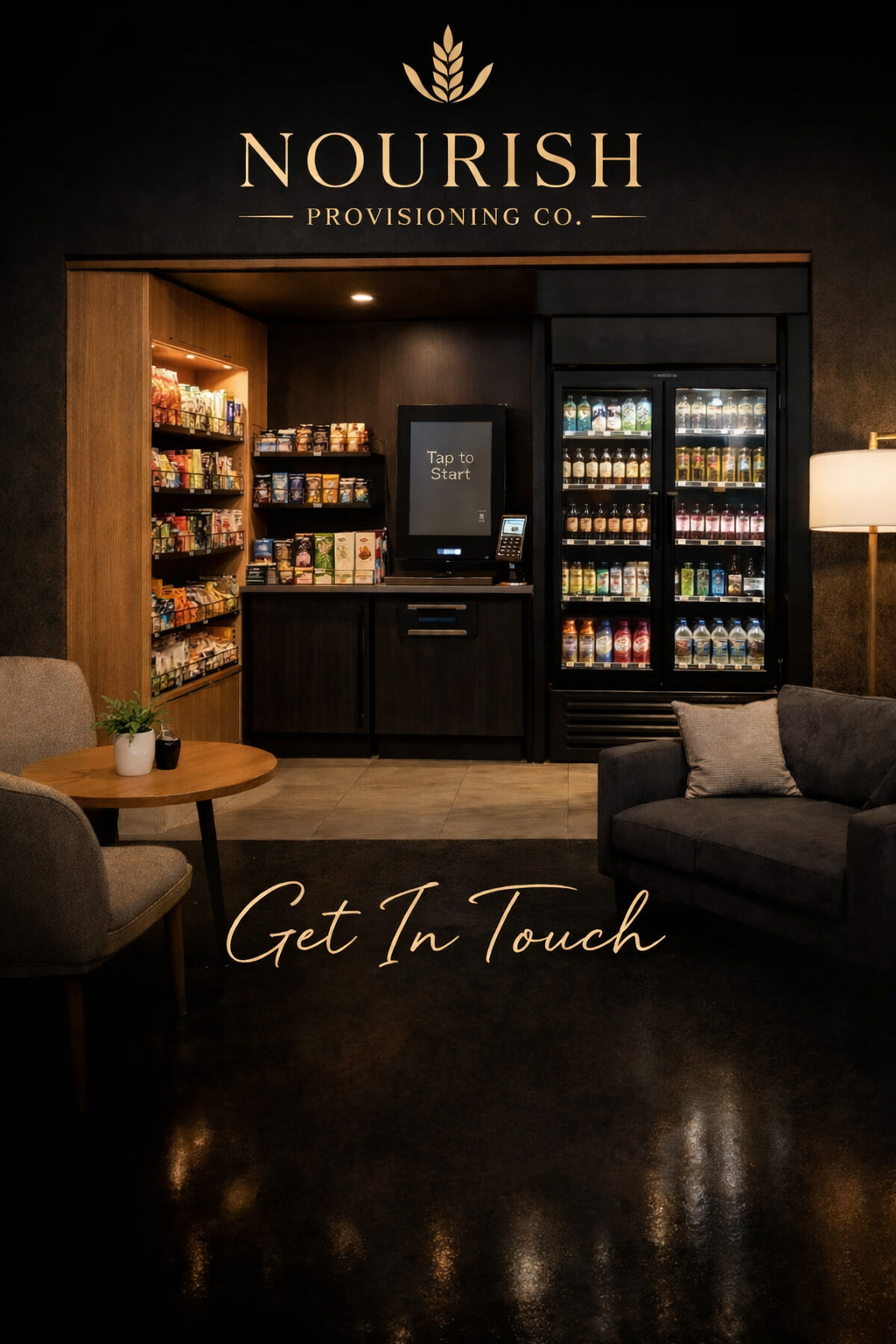 Interior view of a cozy coffee shop or lounge with a snack and beverage vending area. There are chairs and a small table with a plant, a fridge filled with drinks, and a digital kiosk for ordering. The wall displays the logo 'Nourish Provisioning Co.' and the phrase 'Get In Touch' written on the floor.