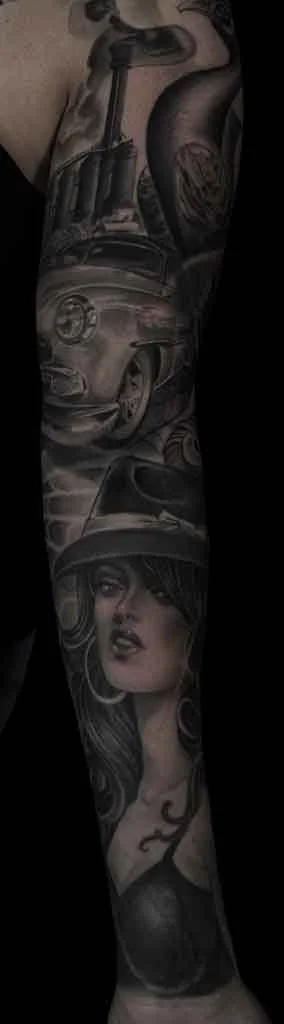 A tribute  tattoo to her hometown in an Mexican Americana whole black and grey tattoo style by Jewp