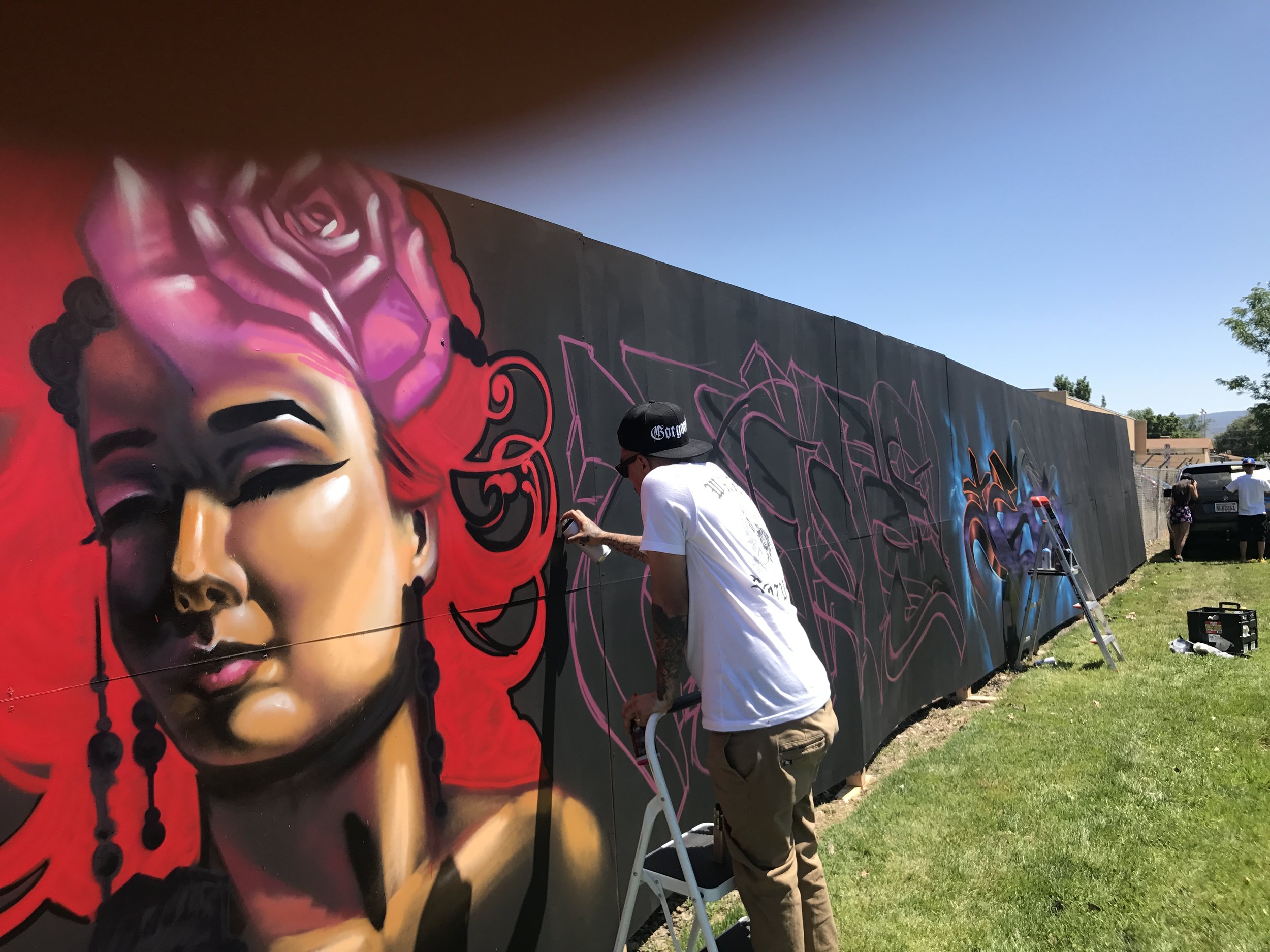 Jewp paints a Lady face at a Graffiti Jam in Grand Junction Co at a skate park circa 2014 with Tuke DF crew 