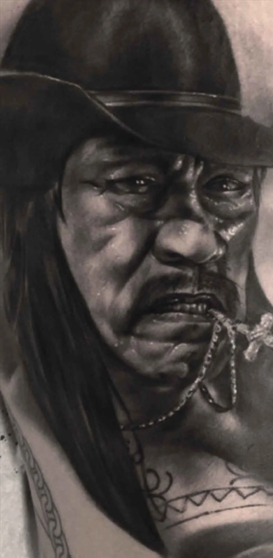 Black and grey realistic portrait of actor Danny Trejo 