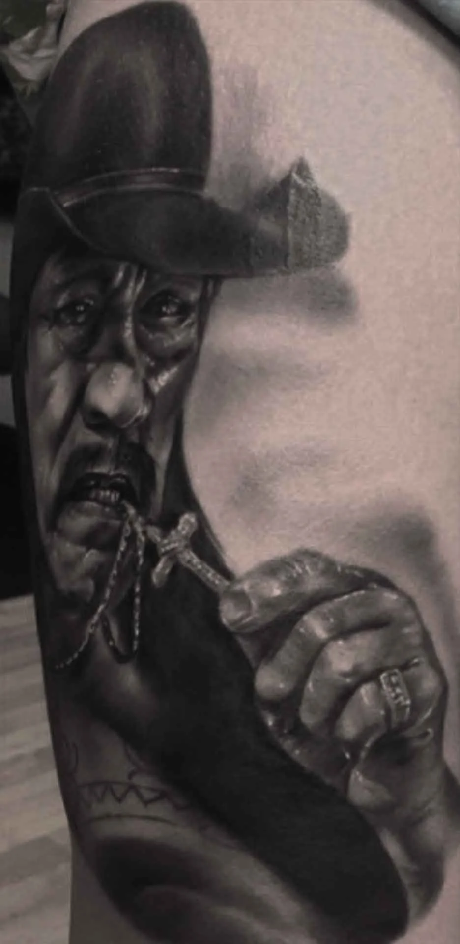 Black and grey realistic portrait of actor Danny Trejo 