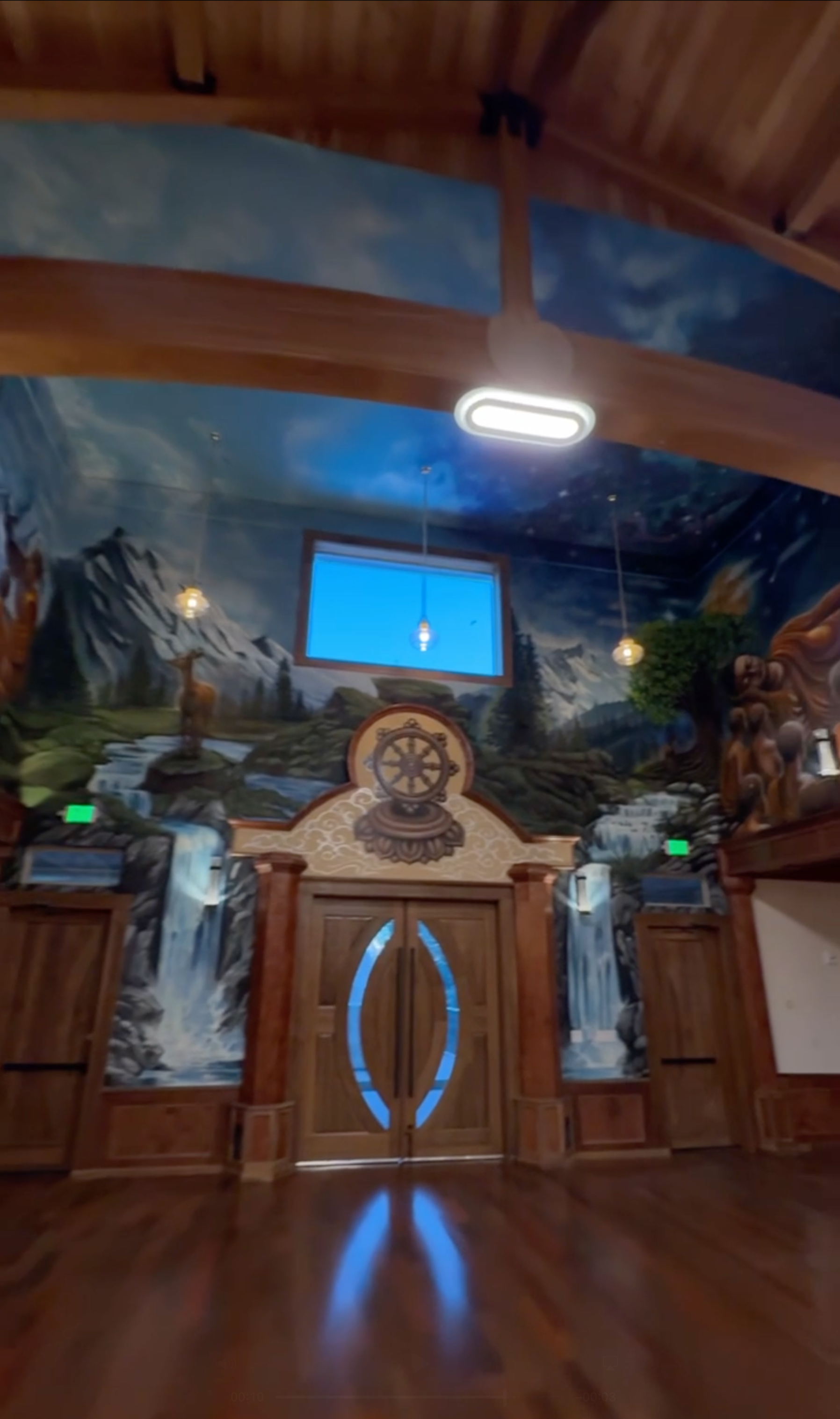 finished 3d buddha mural on front wall of monastery hall