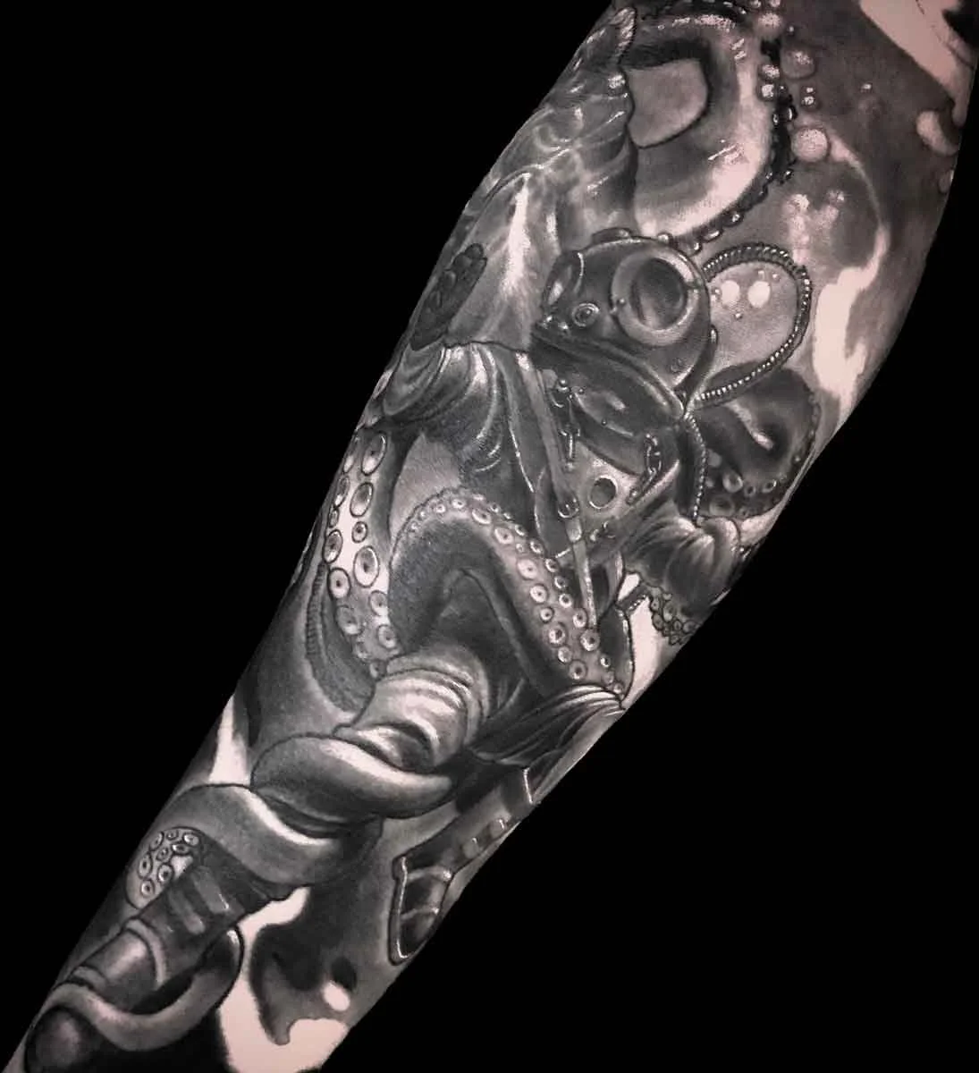 an underwater scene featuring a diver and an octopus fighting in a black and grey tattoo style 