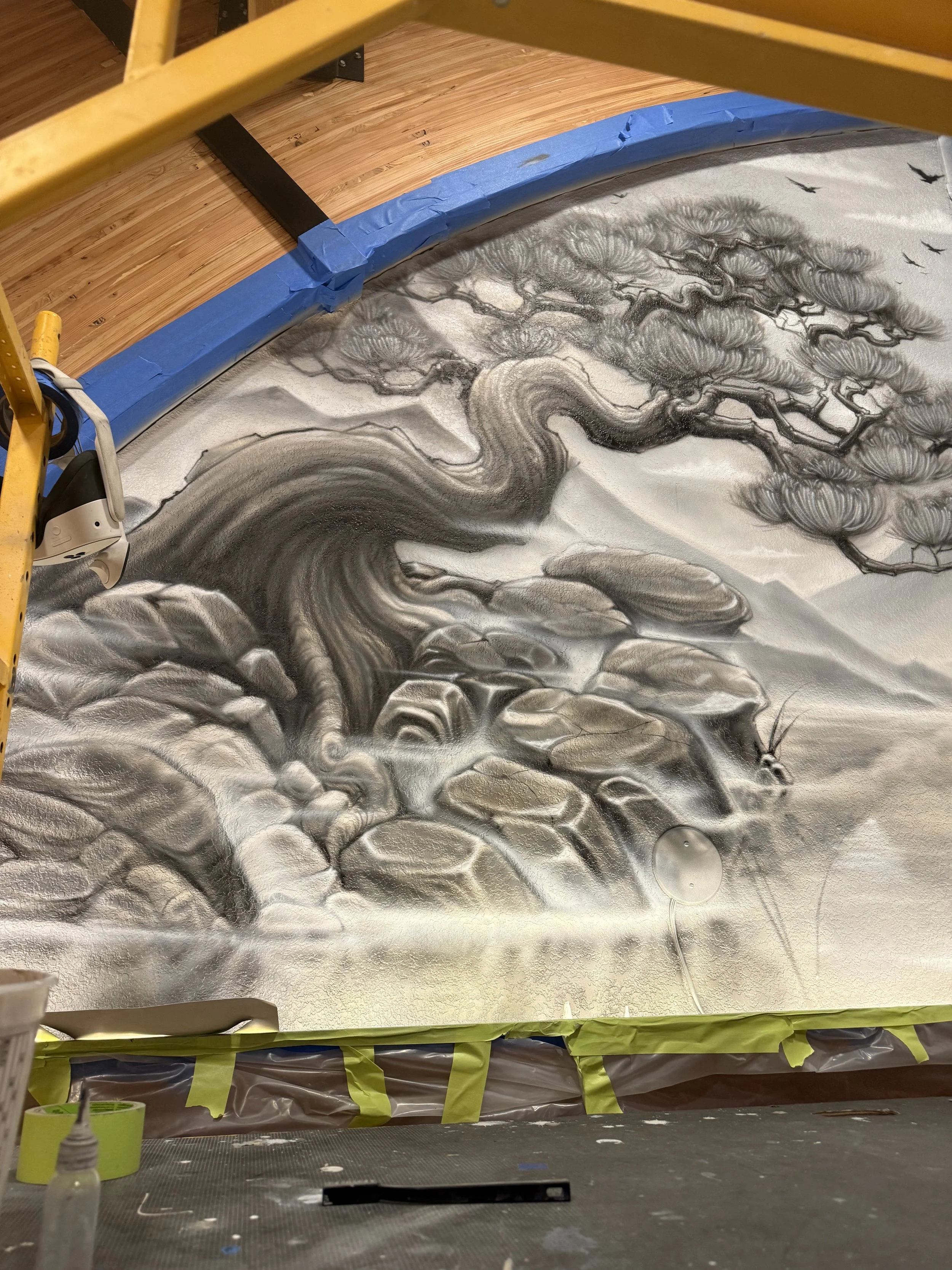 Detail of bonsai tree on left adjacent wall above shelves in Buddha hall