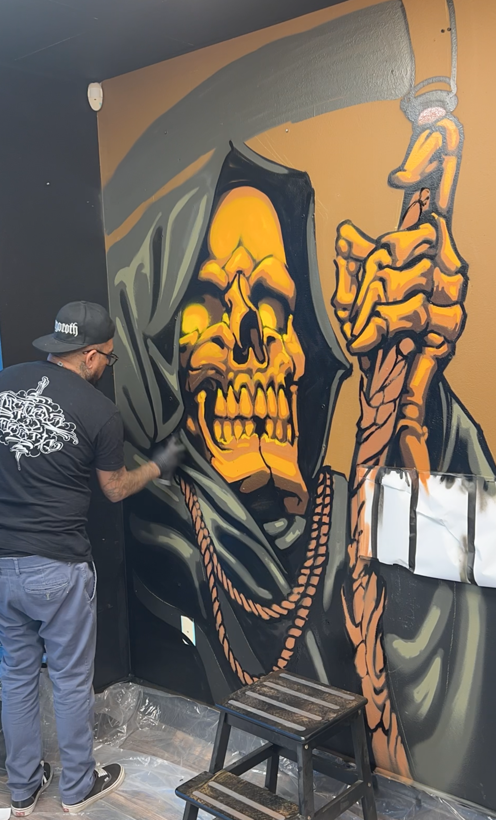 Jewp pants a grim Reaper inside of The Crucible Tattoo in Lakewood Colorado circa 2020