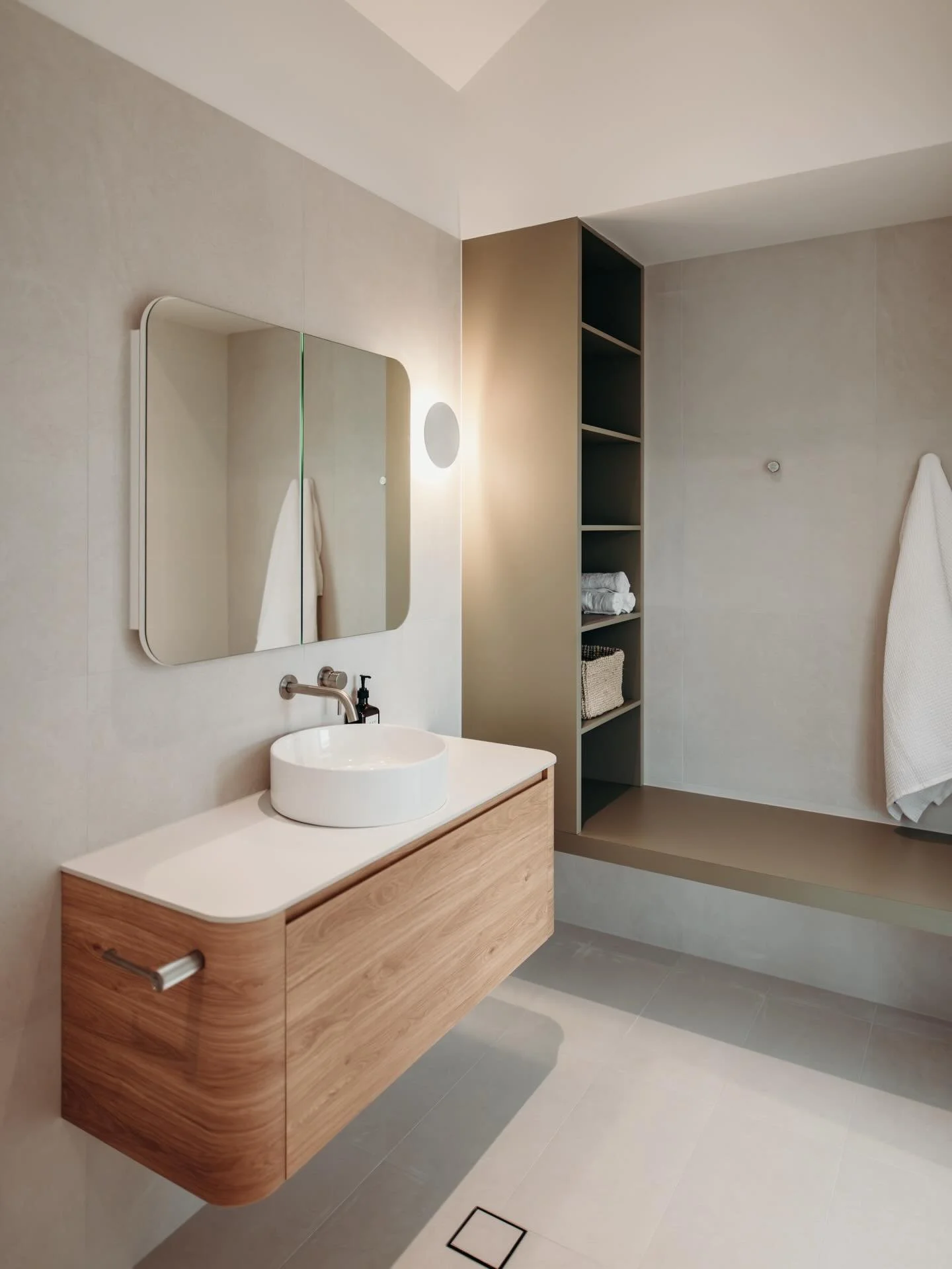 An ensuite can provide an everyday sanctuary. 

Combining a practical layout with considered detailing and warm ambient light, this space can support and enhance your everyday rituals. 

Builder: @musebuilt 
Joinery: @inovative_interiors 
Photography