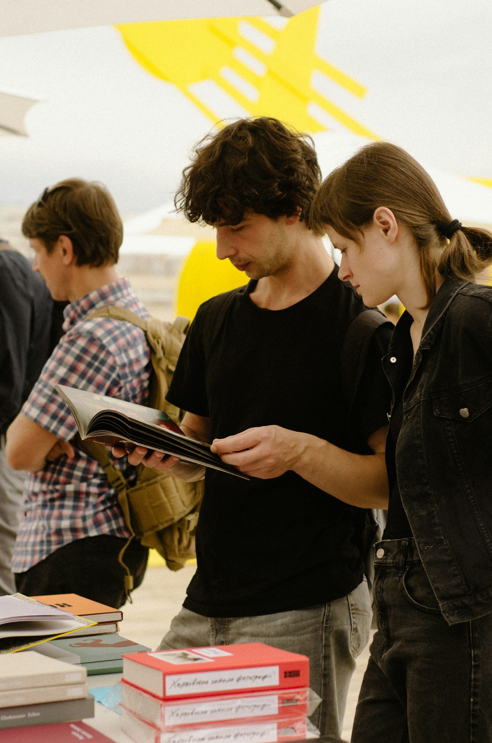 person interacting in the book fair.