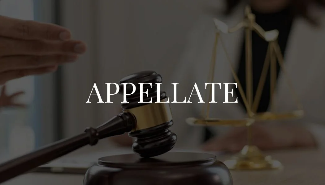 A judge's gavel and a set of legal scales on a desk with the word 'APPEALATE' overlayed.