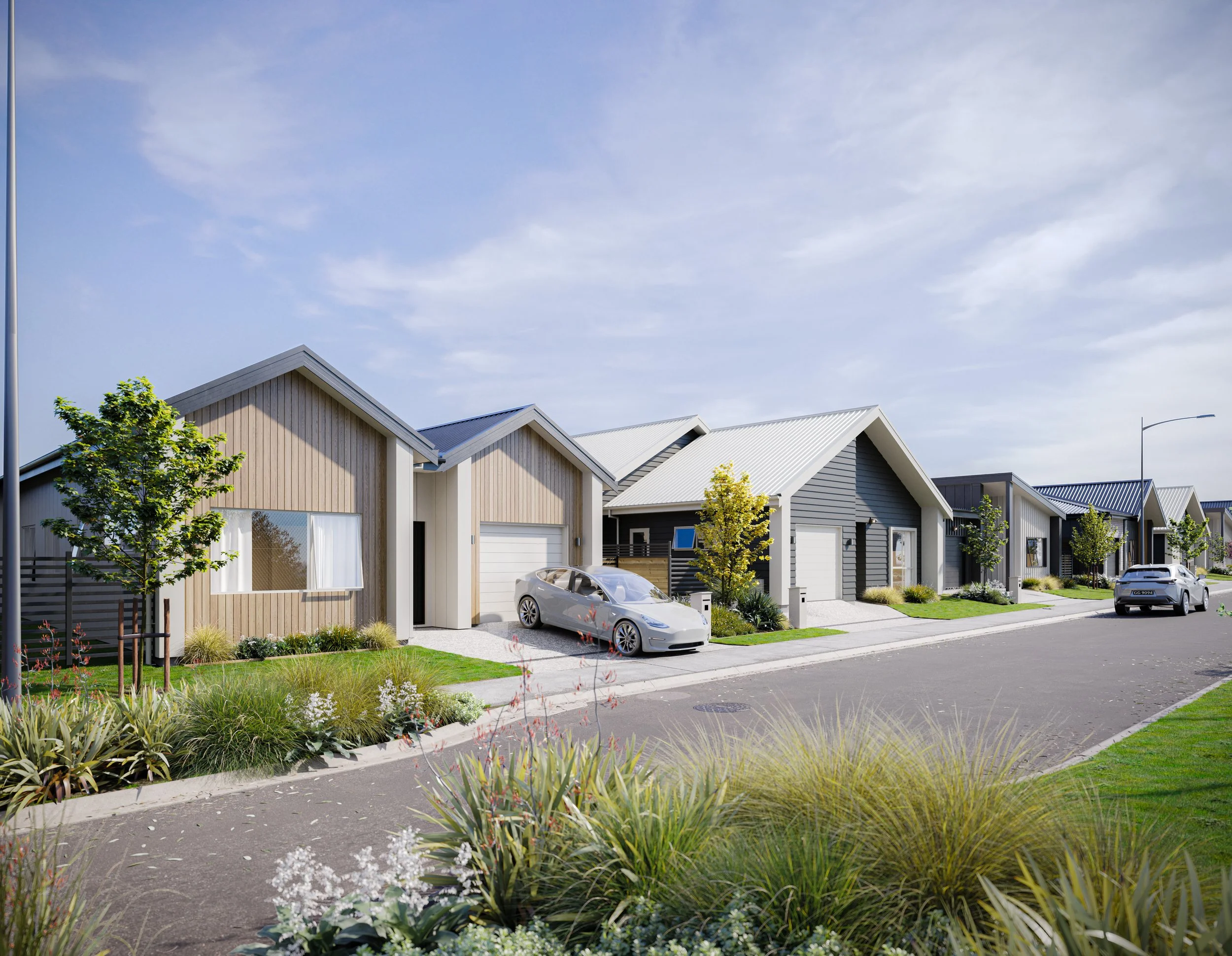A render of Gillies Group's development in Wallaceville Estate, Back Straight, shows modern suburban houses with manicured lawns and parked cars on a sunny day.