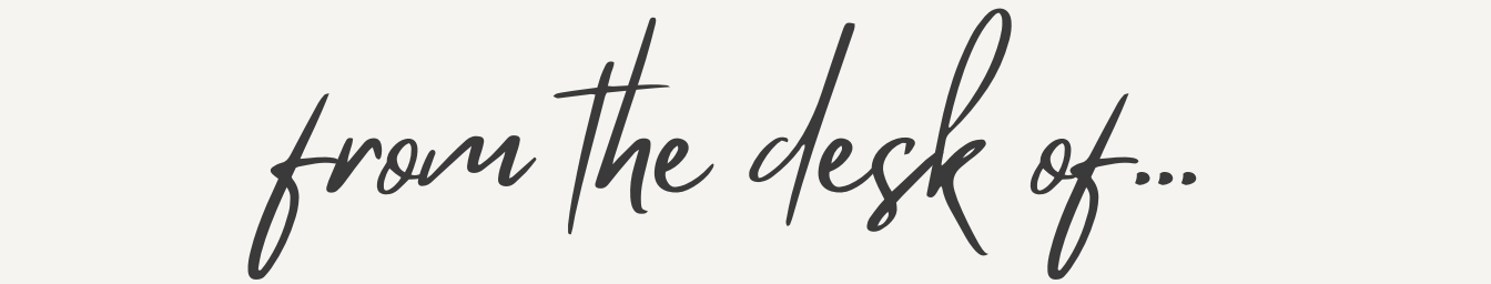 Stylish handwritten text reading "from the desk of..." on a plain white background.