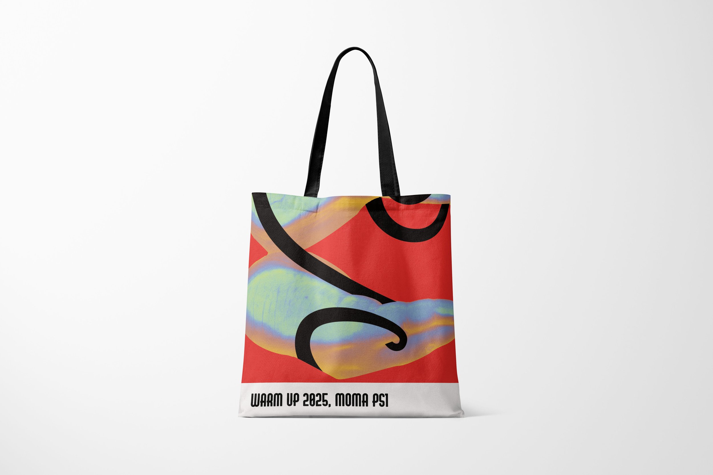 A colorful tote bag with a red, black, and iridescent design, featuring black handles and text that reads 'Warm Up 2025, MOMA PS1' on the bottom white section.