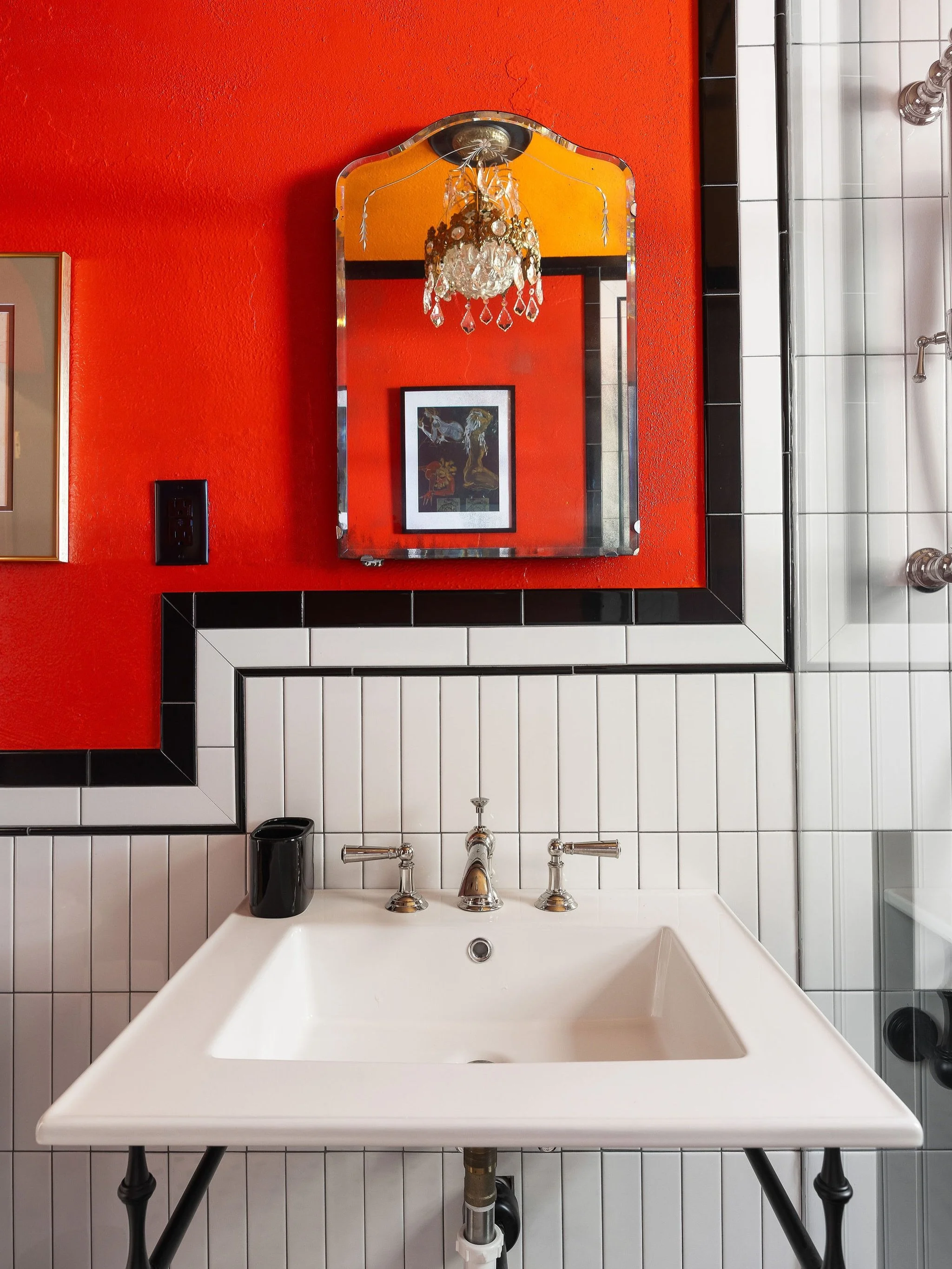 The Orange bathroom at the OM is situated between two of the suites on the second floor. What started as a bathroom with a vintage claw foot tub (a true feat to get that down a spiral staircase!) is now a modern art deco bathroom with a nod to the de