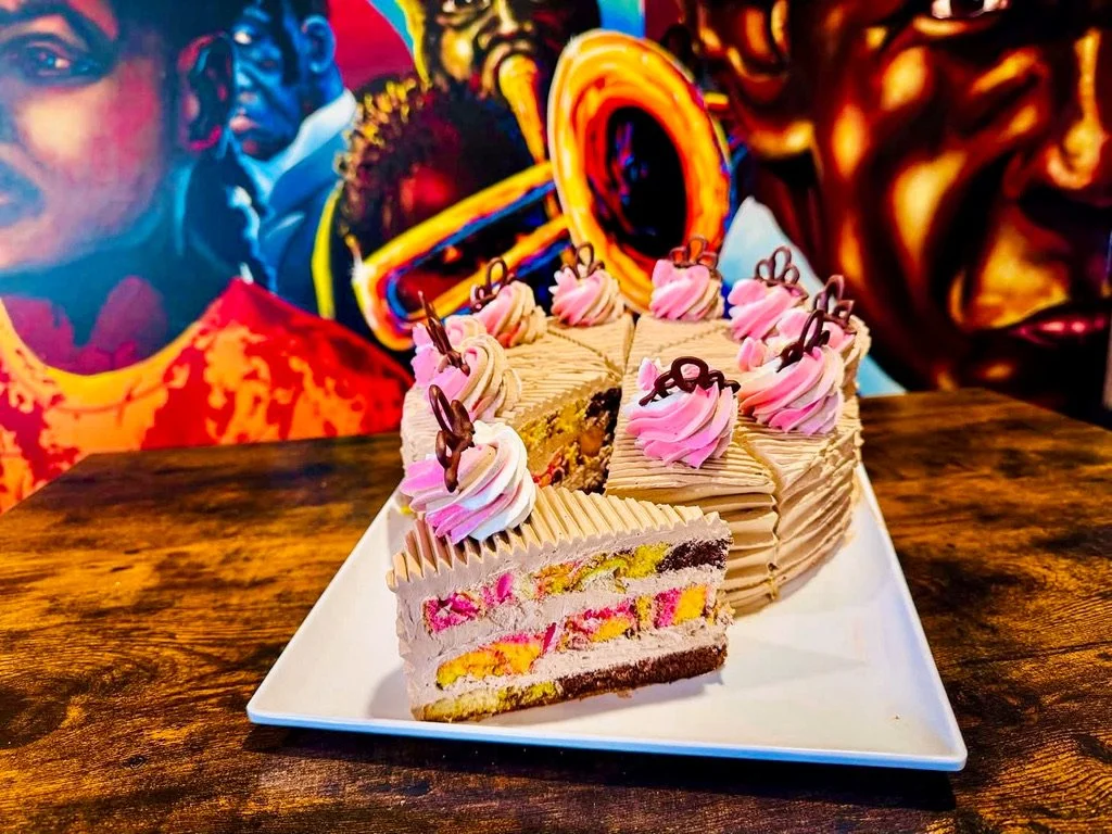 birthday layered cake with pink and brown frosting from Stone Oven bakery and cafe hokitika