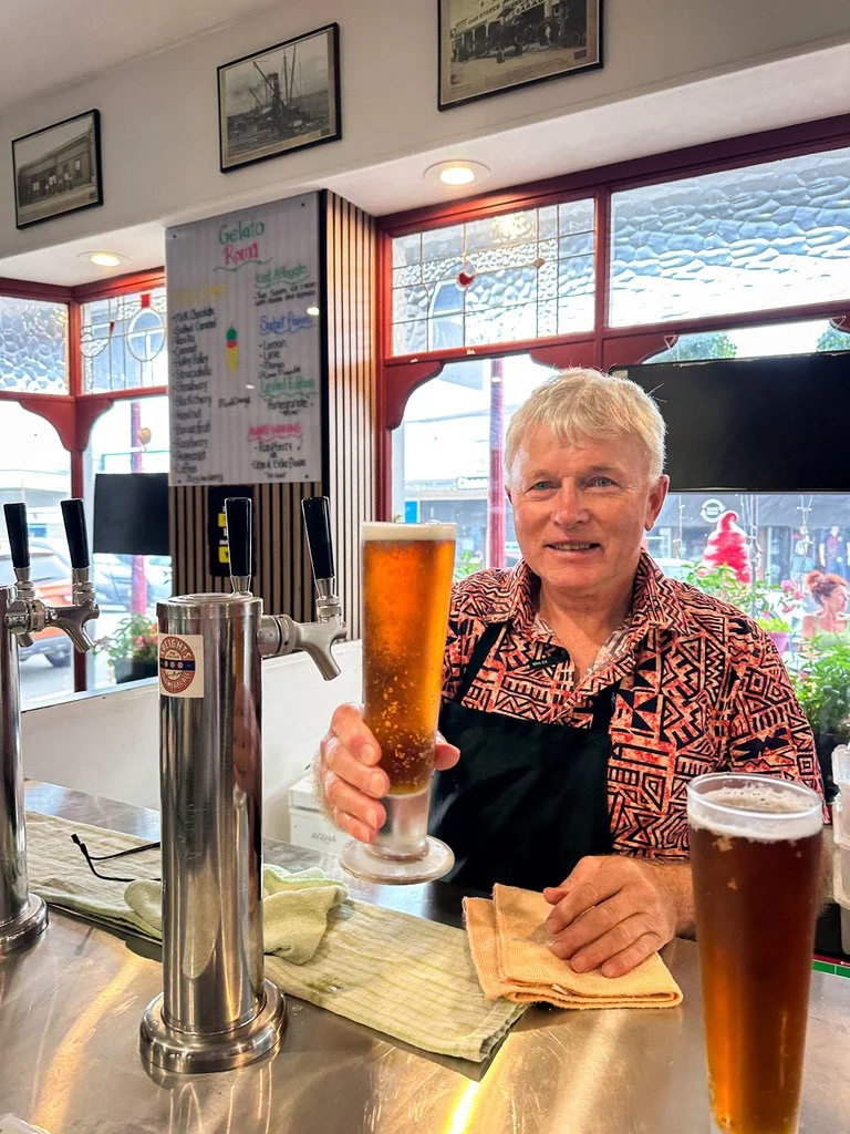 Dicey stone oven bakery and cafe owner serving a beer