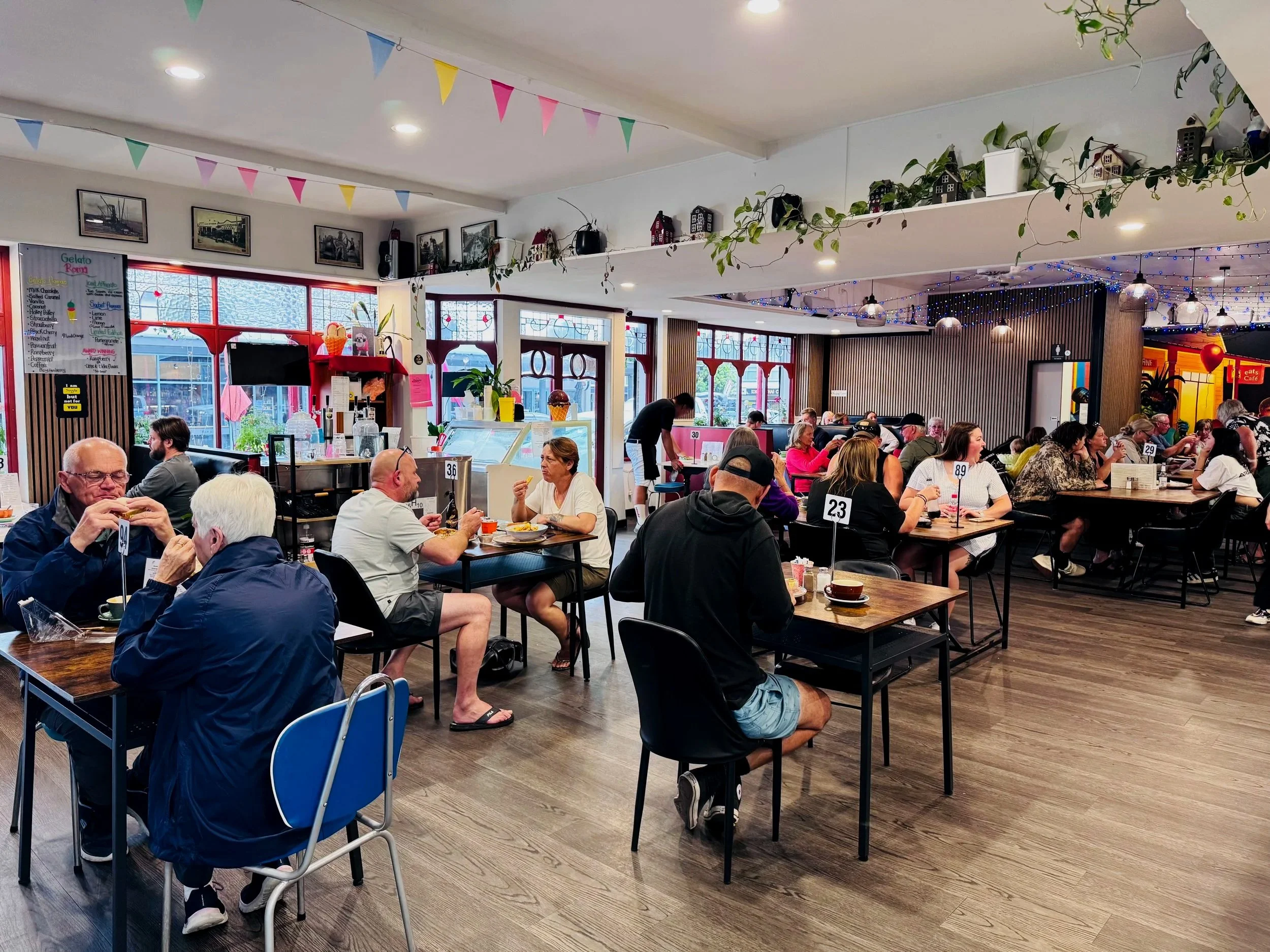 Customers enjoying their food inside stone oven and bakery Hokitika