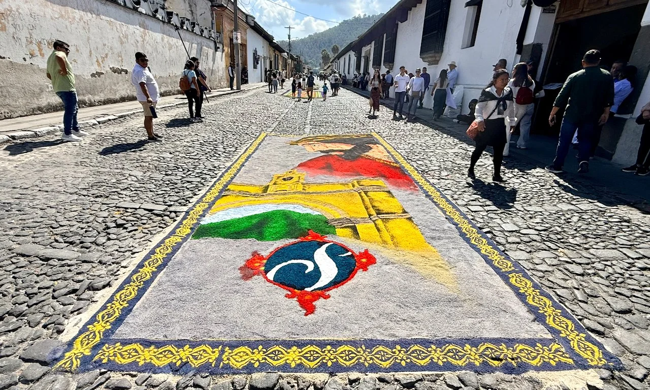 Alfombras (Sawdust Rugs) — Admire the stunning, temporary street carpets made of colored sawdust, flowers, and natural materials.