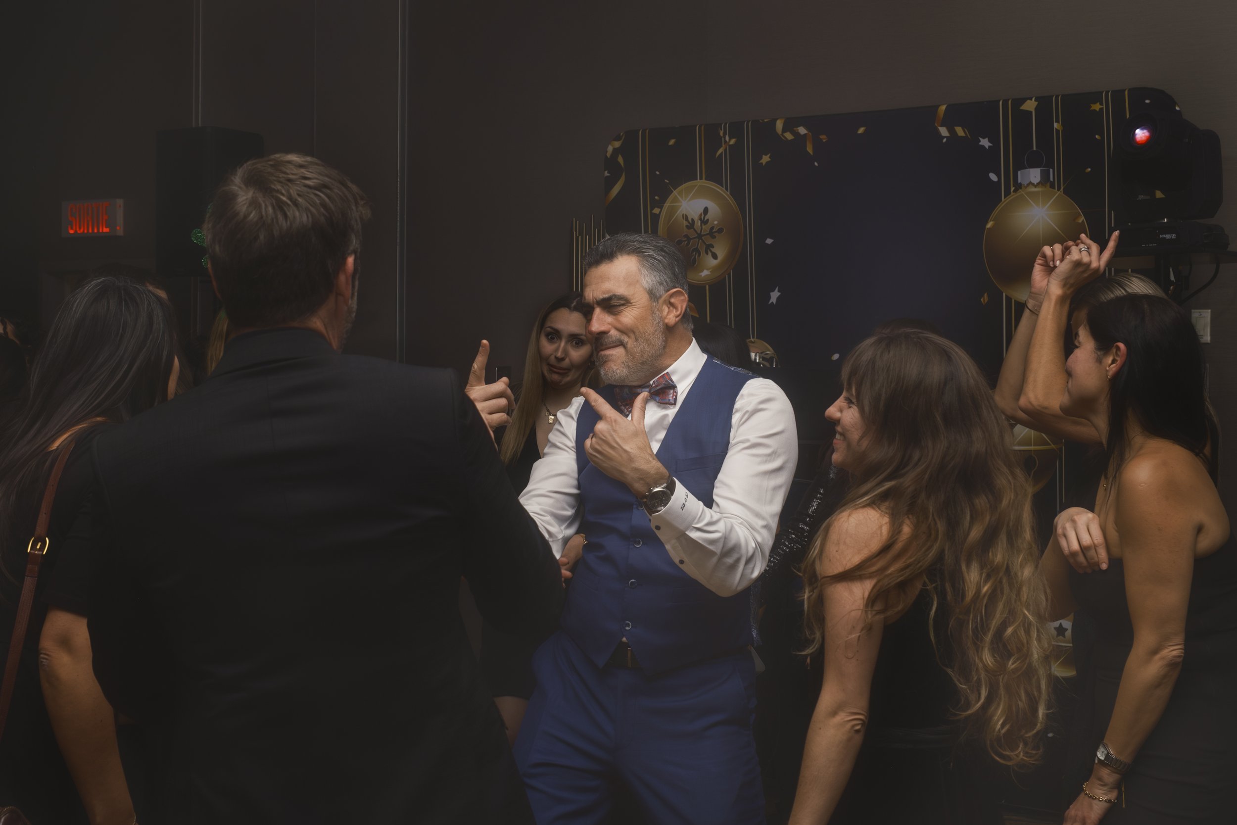 Candid guests socializing during the Urgo holiday corporate event