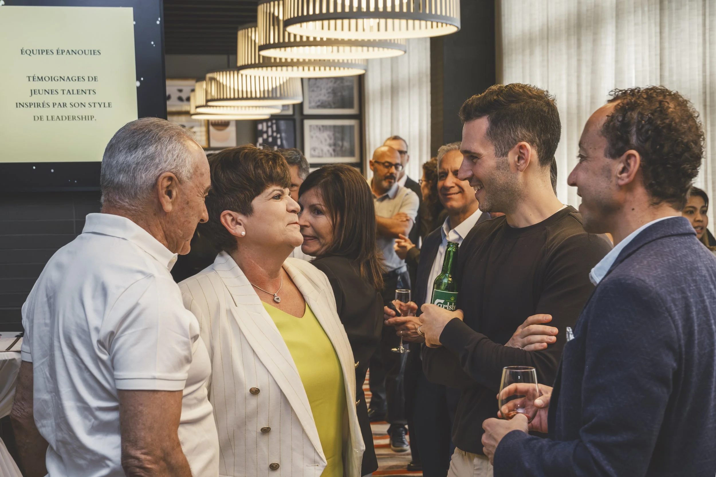 Guests smiling and socializing during a private retirement event