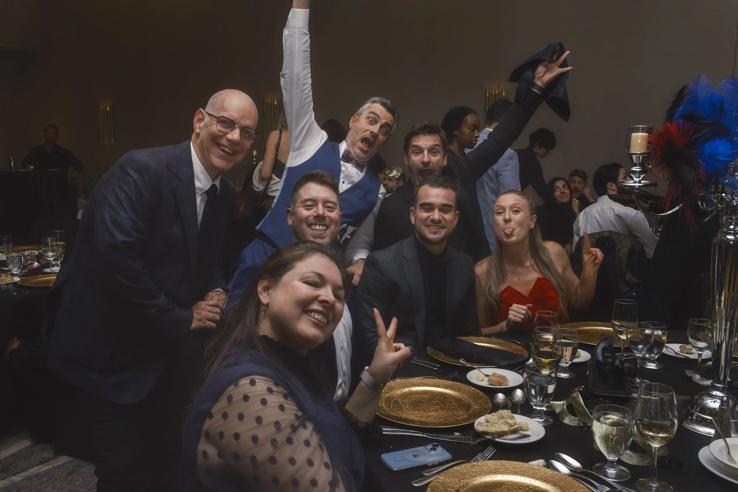 Guests smiling together at a corporate Christmas party photographed for Urgo