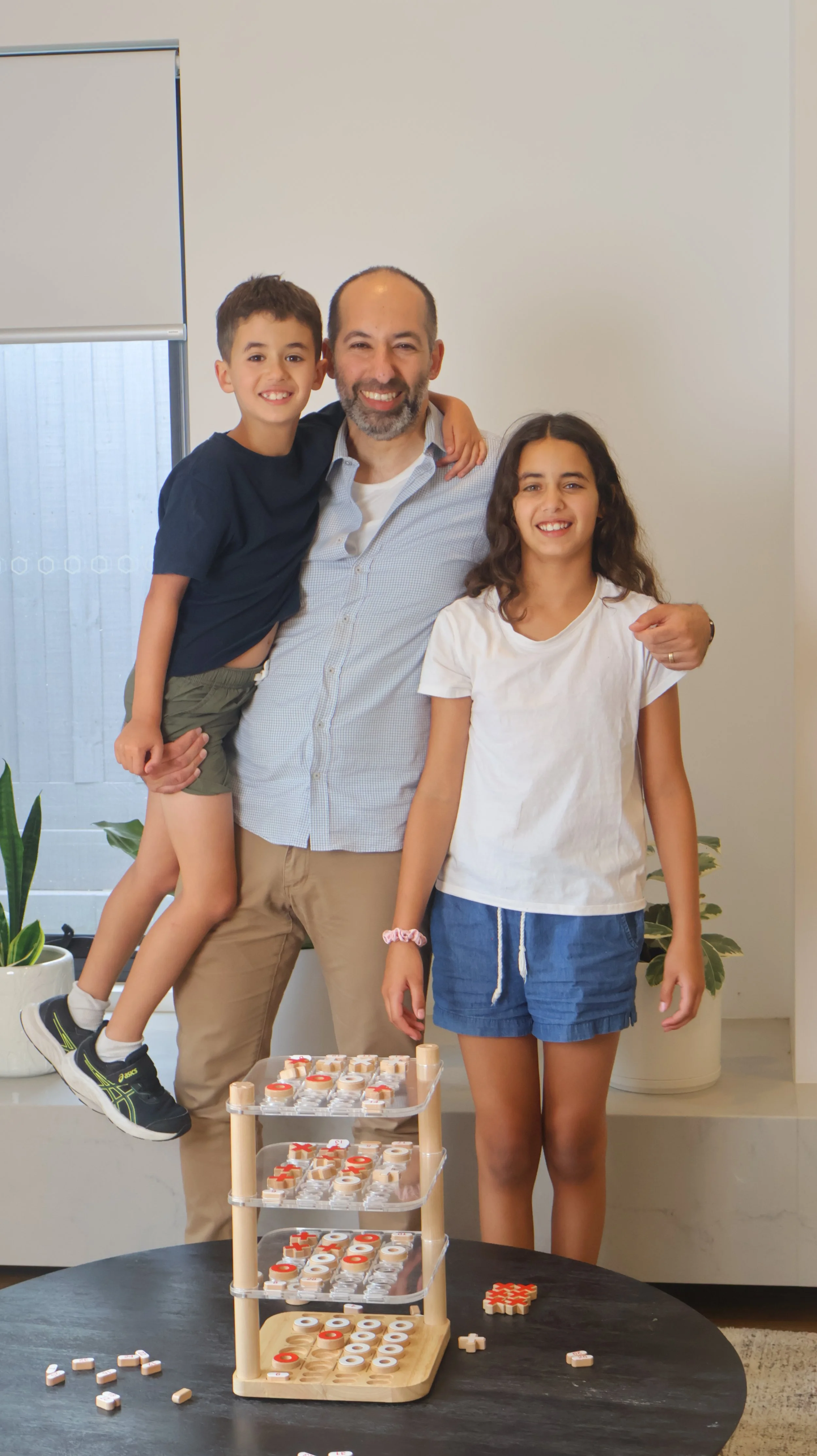 Yoni and his family looking happy into the camera
