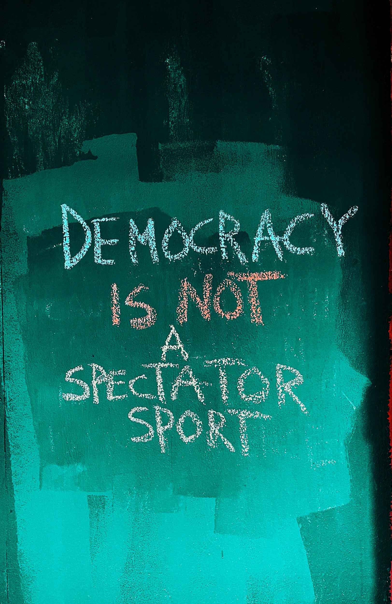 Chalk art reading: democracy is not a spectator sport