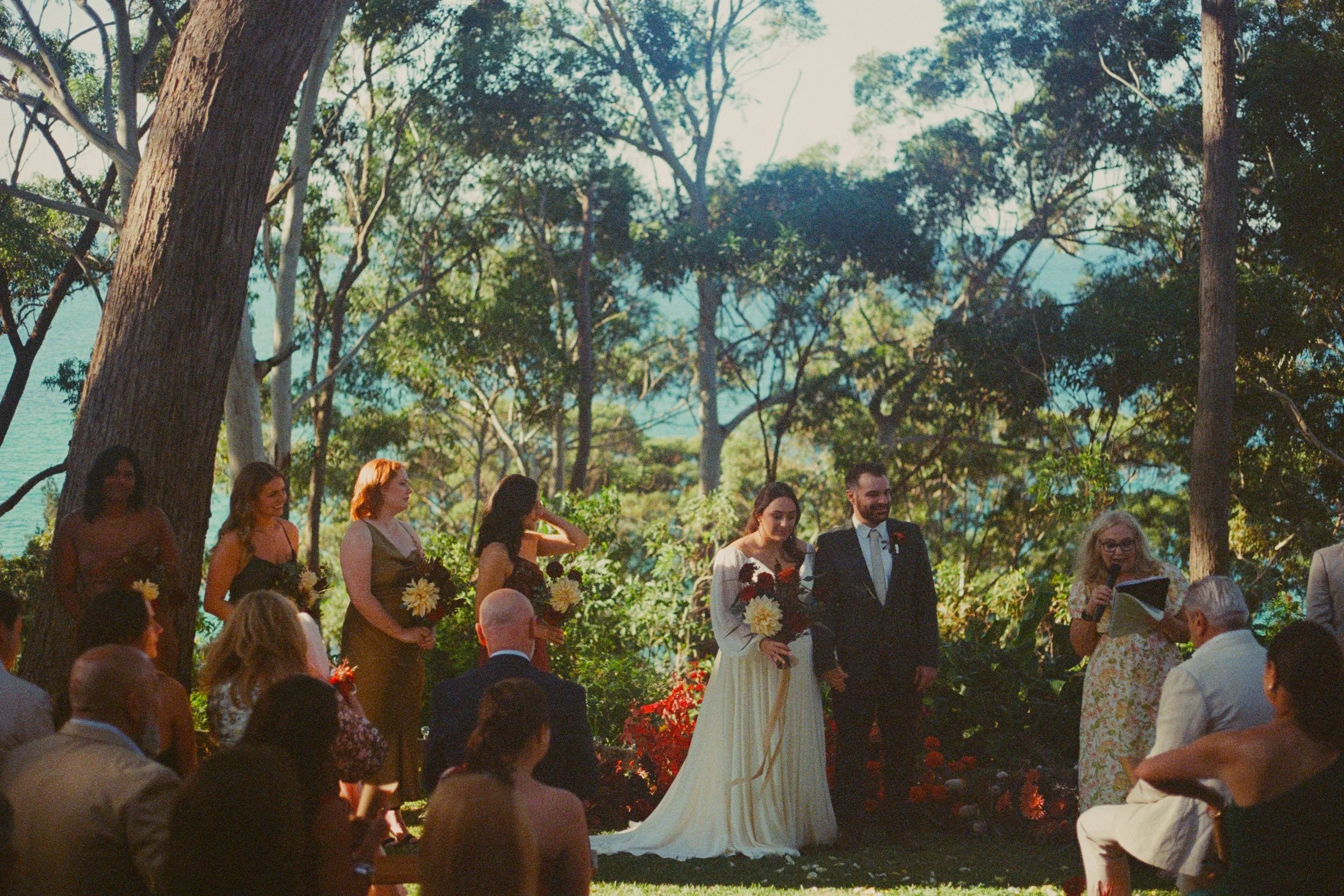 Laurie’s customers, Fernando and Kate embracing by the lake on their wedding day.