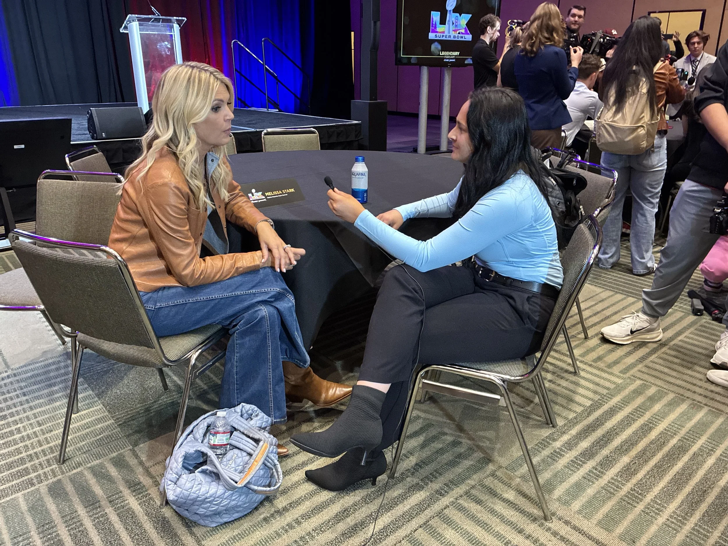 Sarah Galla discussing with Melissa Stark