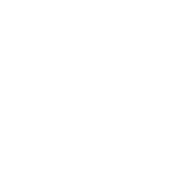 Two people sitting across from each other at a table, engaged in conversation.