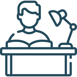 Line drawing of a person sitting at a desk with a desk lamp.