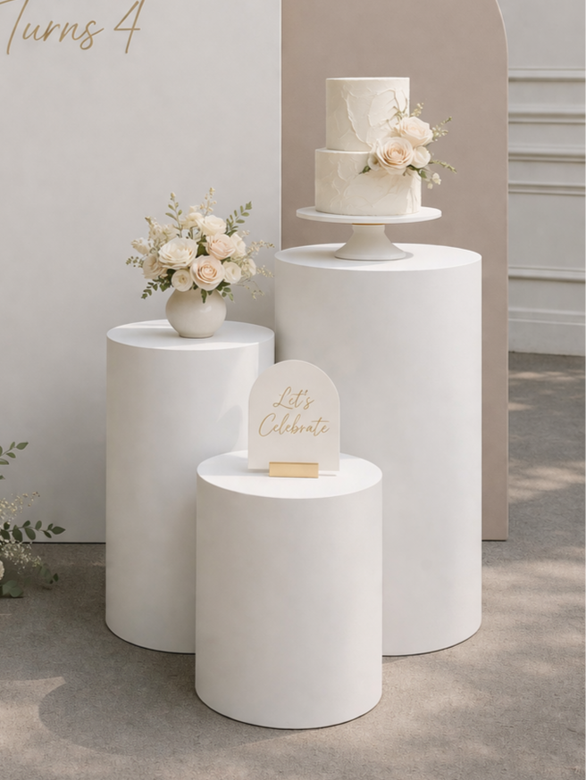 White plinth backdrop setup with balloons and florals for event hire in Cape Town