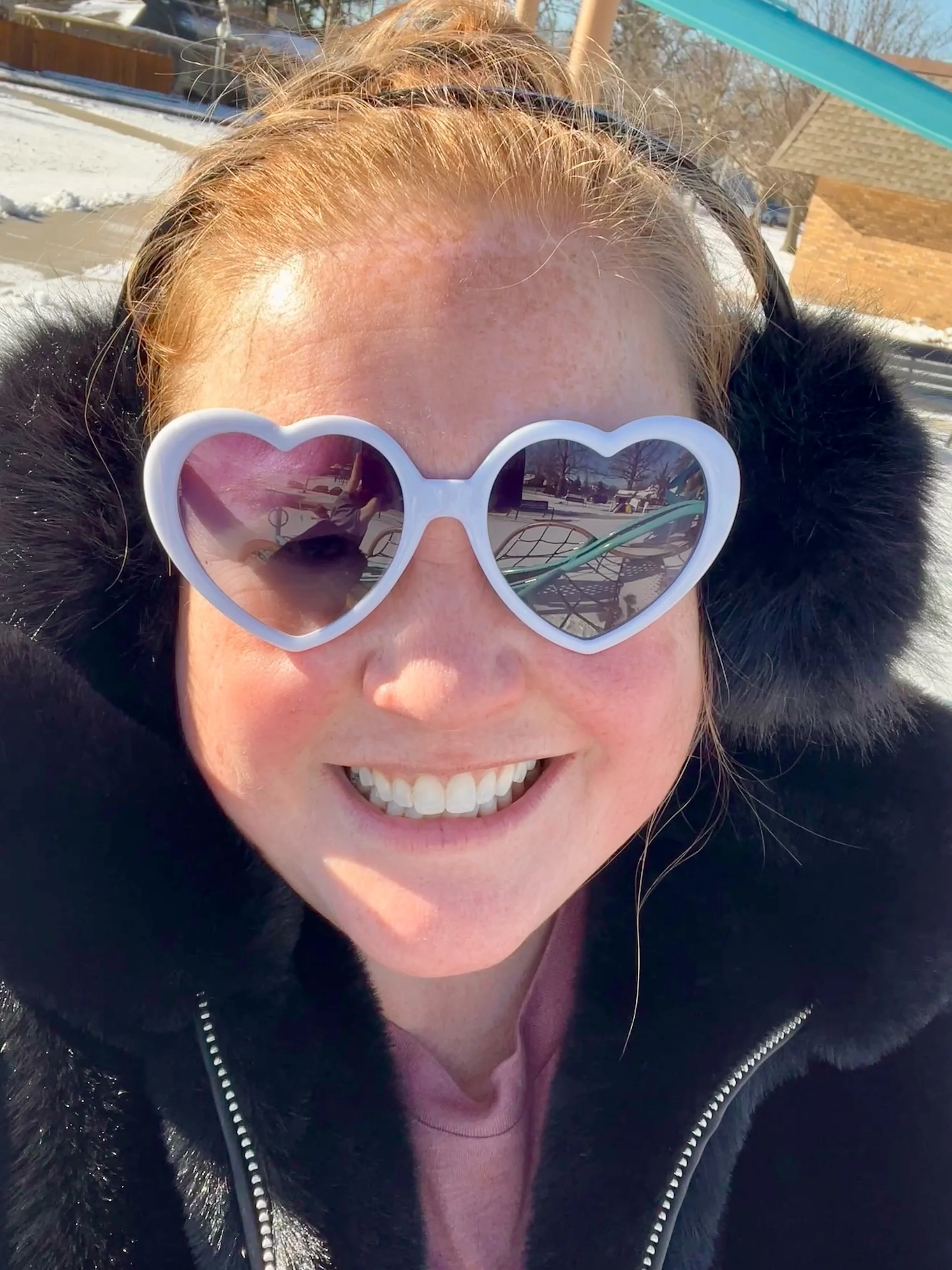 Picture of Megan A. Stardust in heart sunglasses.