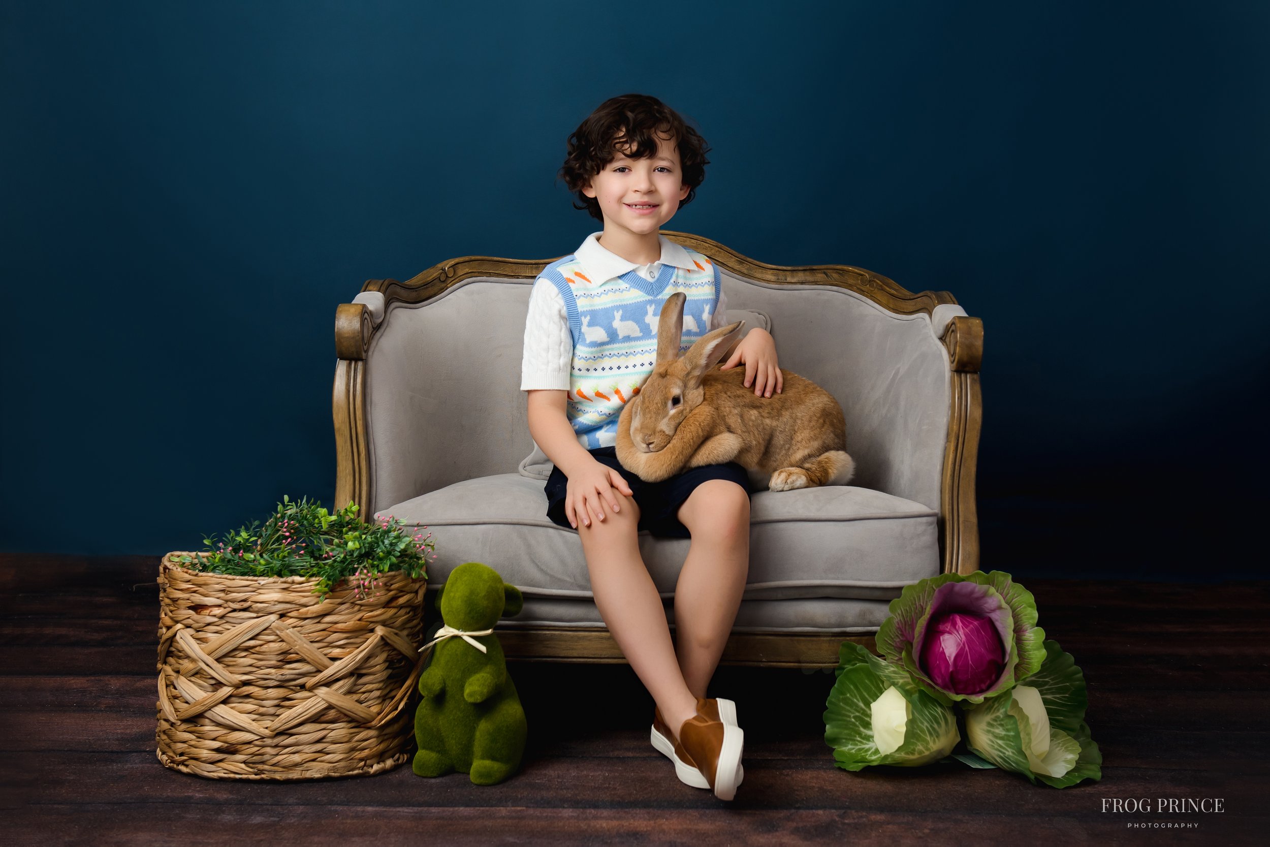 Boy laughing with bunnies during Texas Hill Country spring mini session