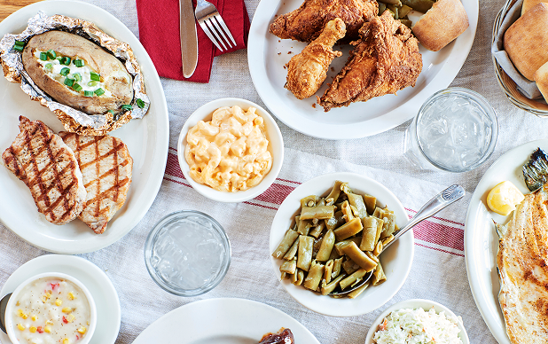 Southern Classics including fried chicken, macaroni and cheese, green beans, rolls and more on the table at The Old Mill Restaurant