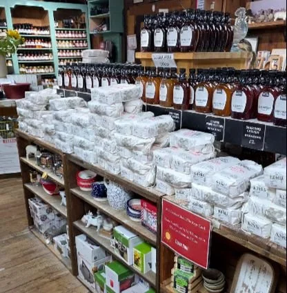 Shelves displaying assorted pancake and waffle batters and rich, syrups