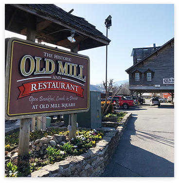 Exterior shot of the sign for The Historic Old Mill and Restaurant